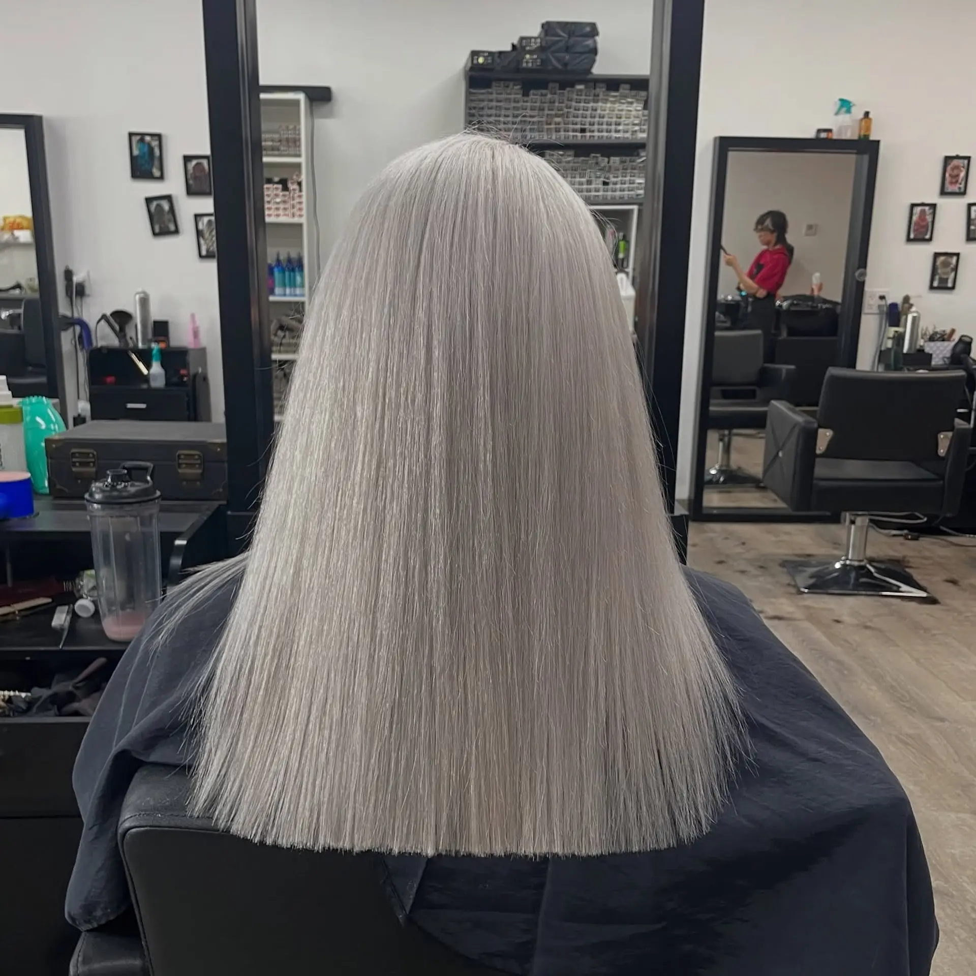 A long, sleek, straight hairstyle with a blunt, straight cut. 1