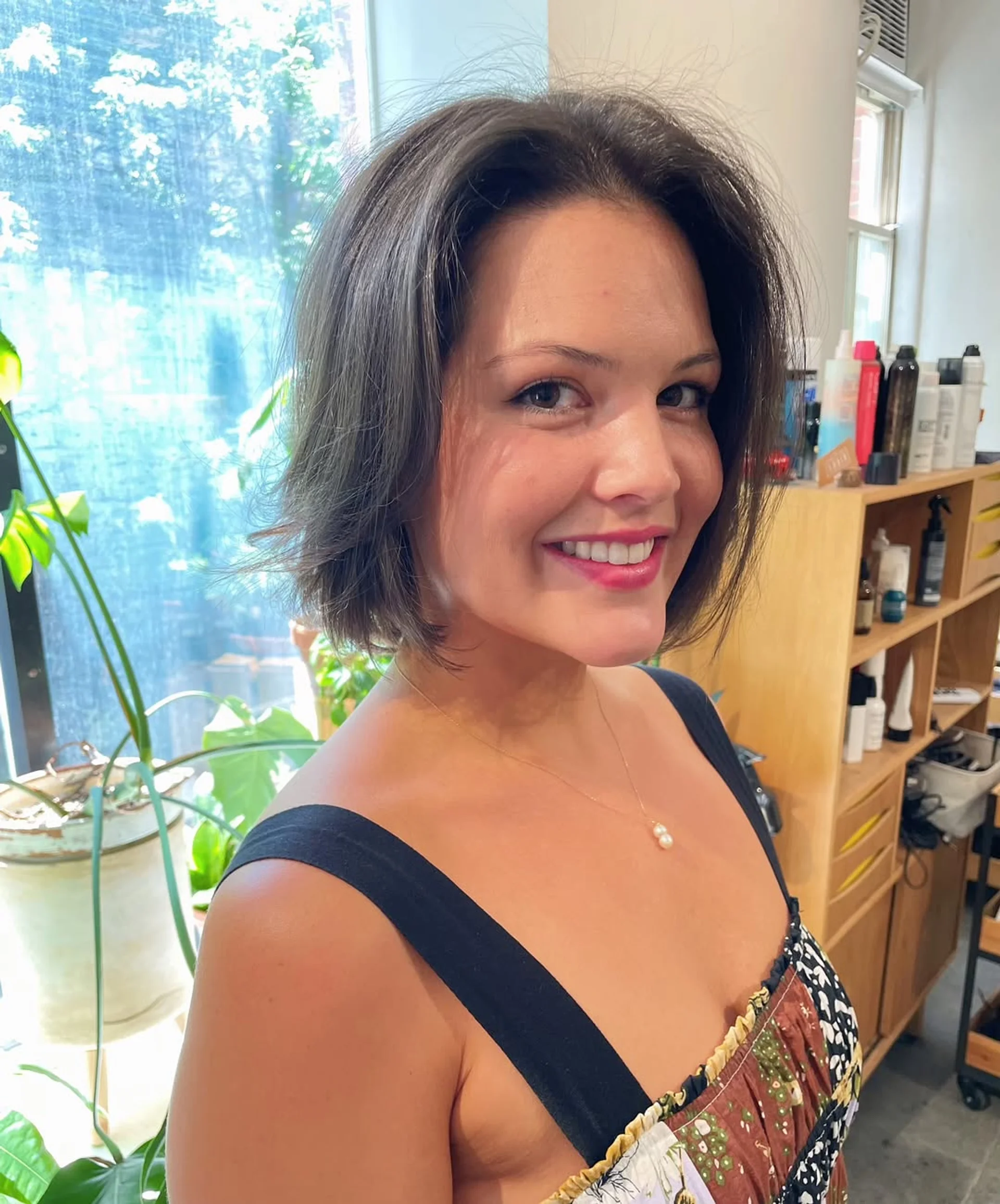 A modern blunt bob with subtle face-framing layers perfectly demonstrating precision shaping for fine hair. - Preview 2