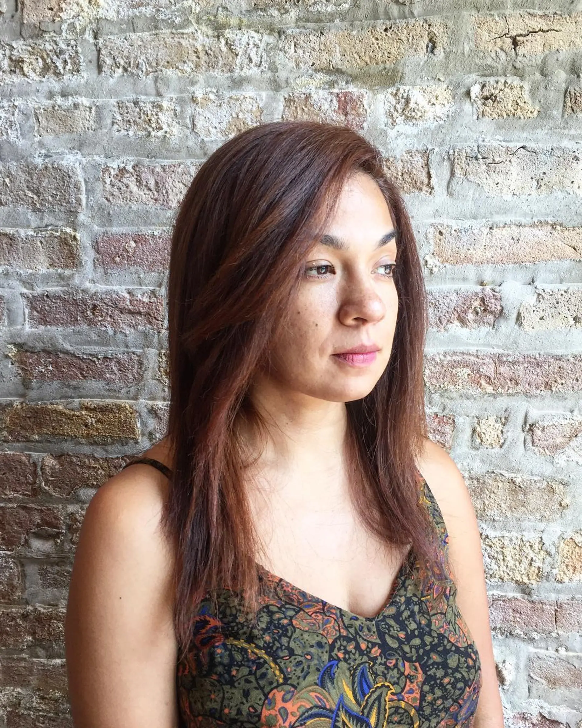 A chic medium-length lob with face-framing layers, perfect for straight hair. 1