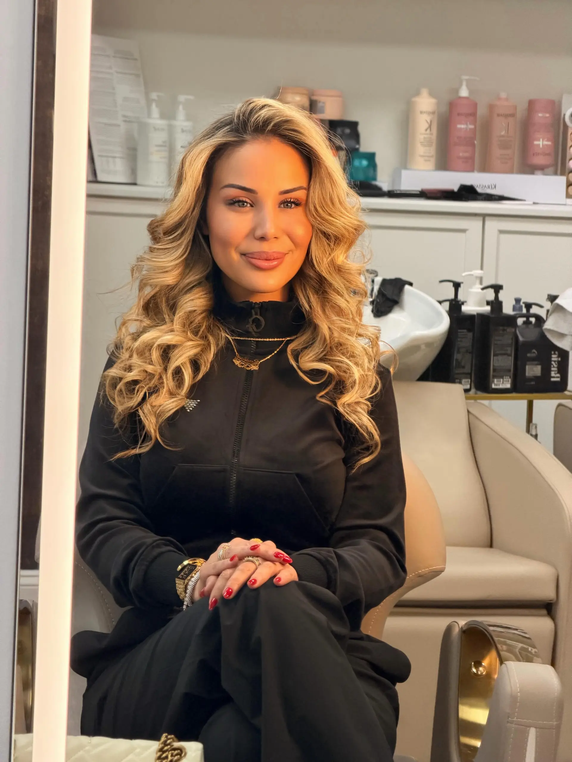 Long dimensional golden blonde hair styled in voluminous, polished waves. 1