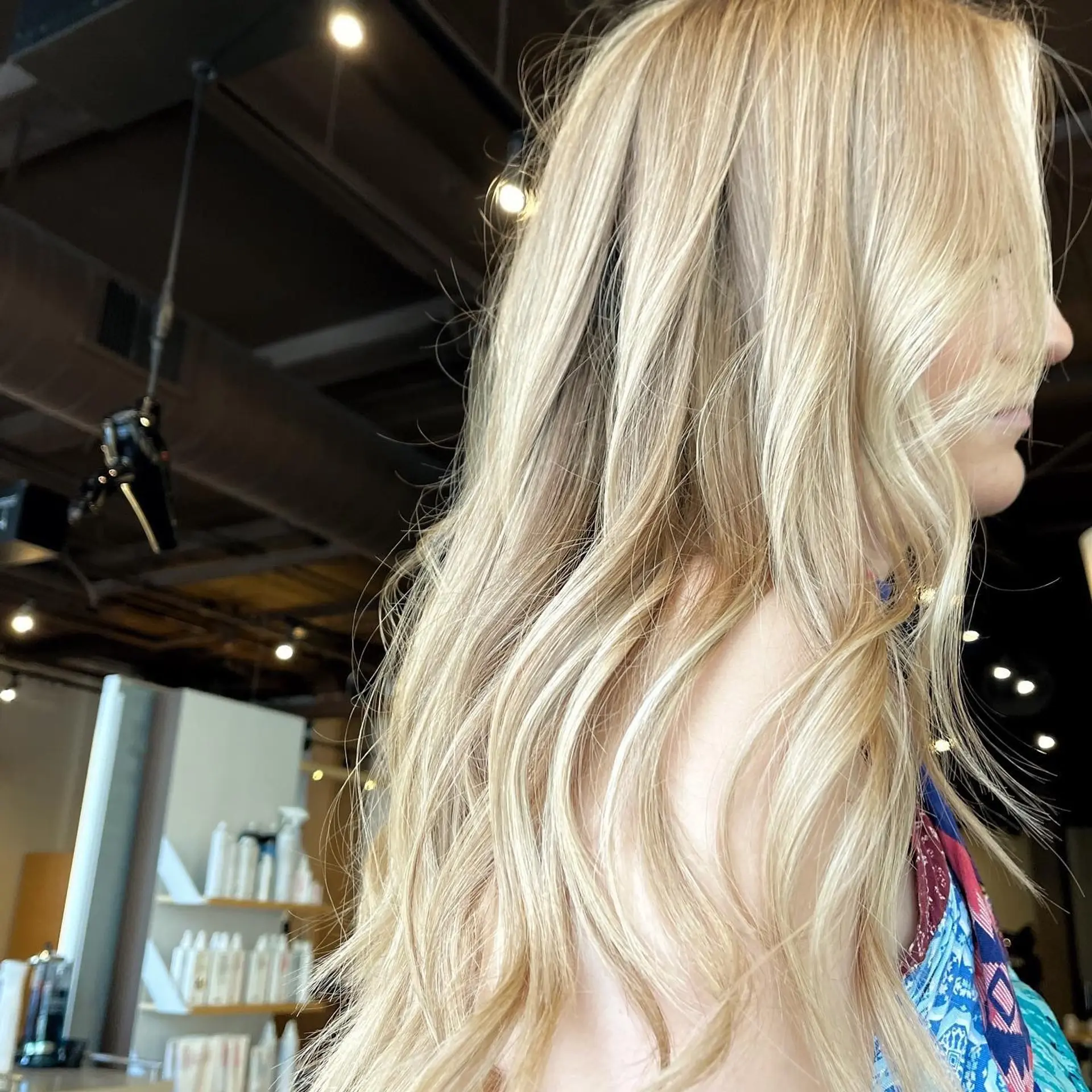 Long, wavy blonde hairstyle with a beautiful balayage and beachy waves. 1