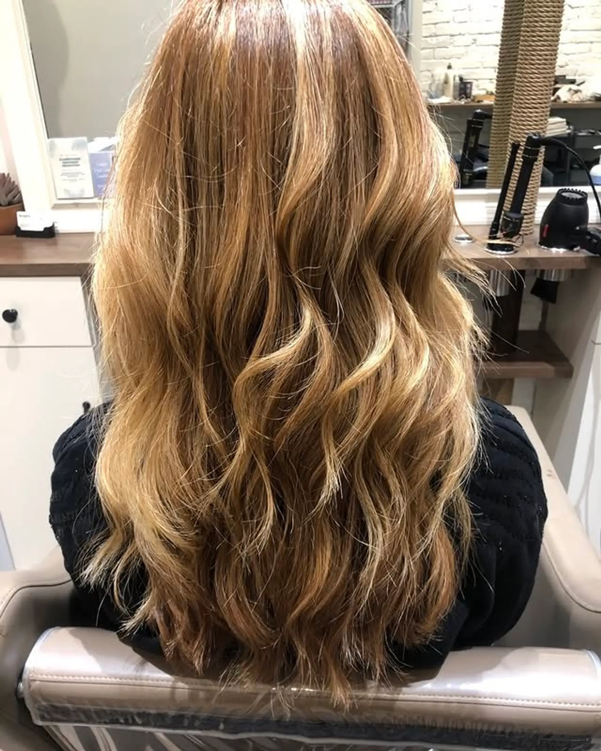 Long, wavy hair with a honey blonde balayage. 1