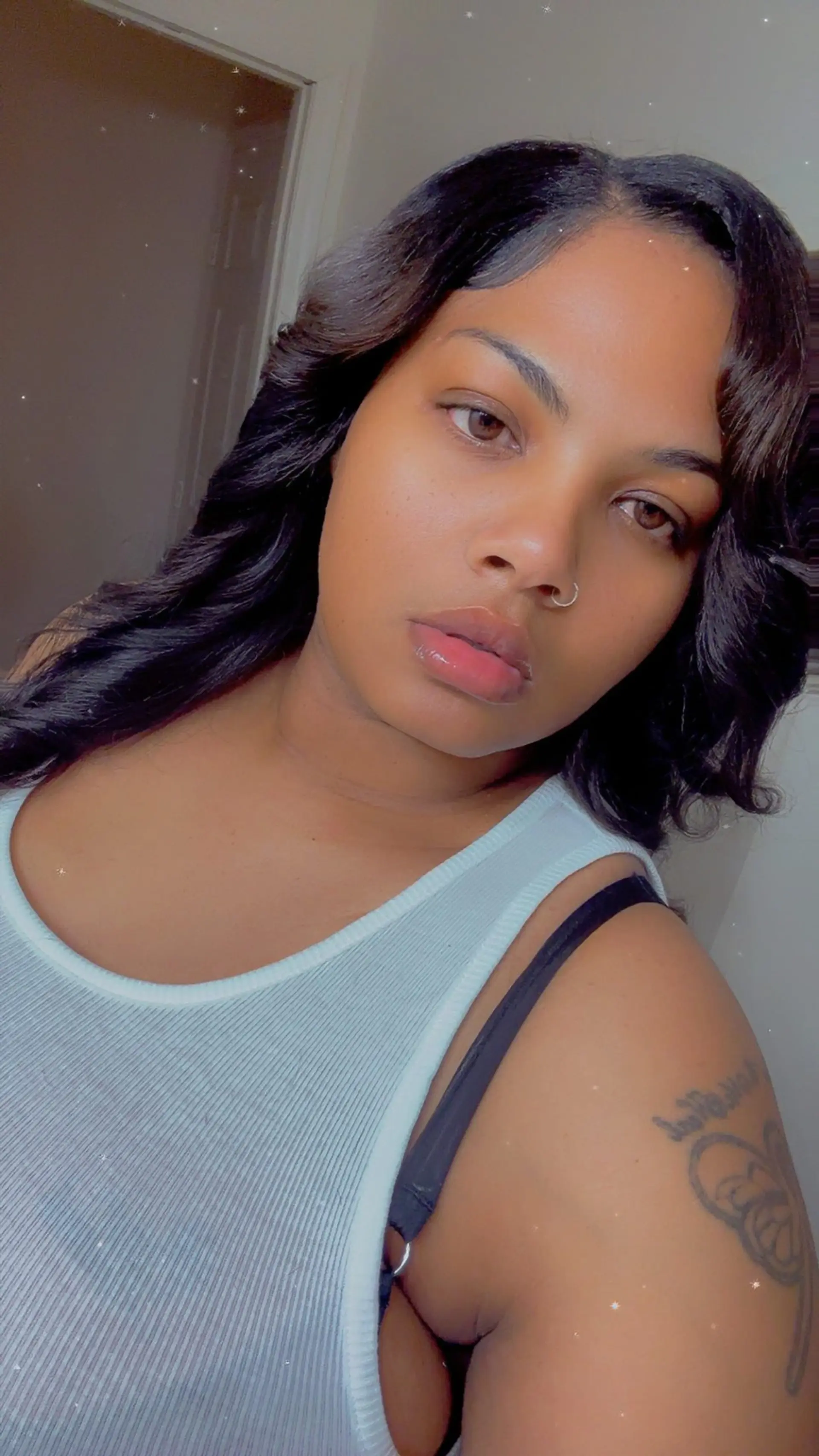 Medium-length sew-in styled into loose, voluminous body waves with styled edges. 1