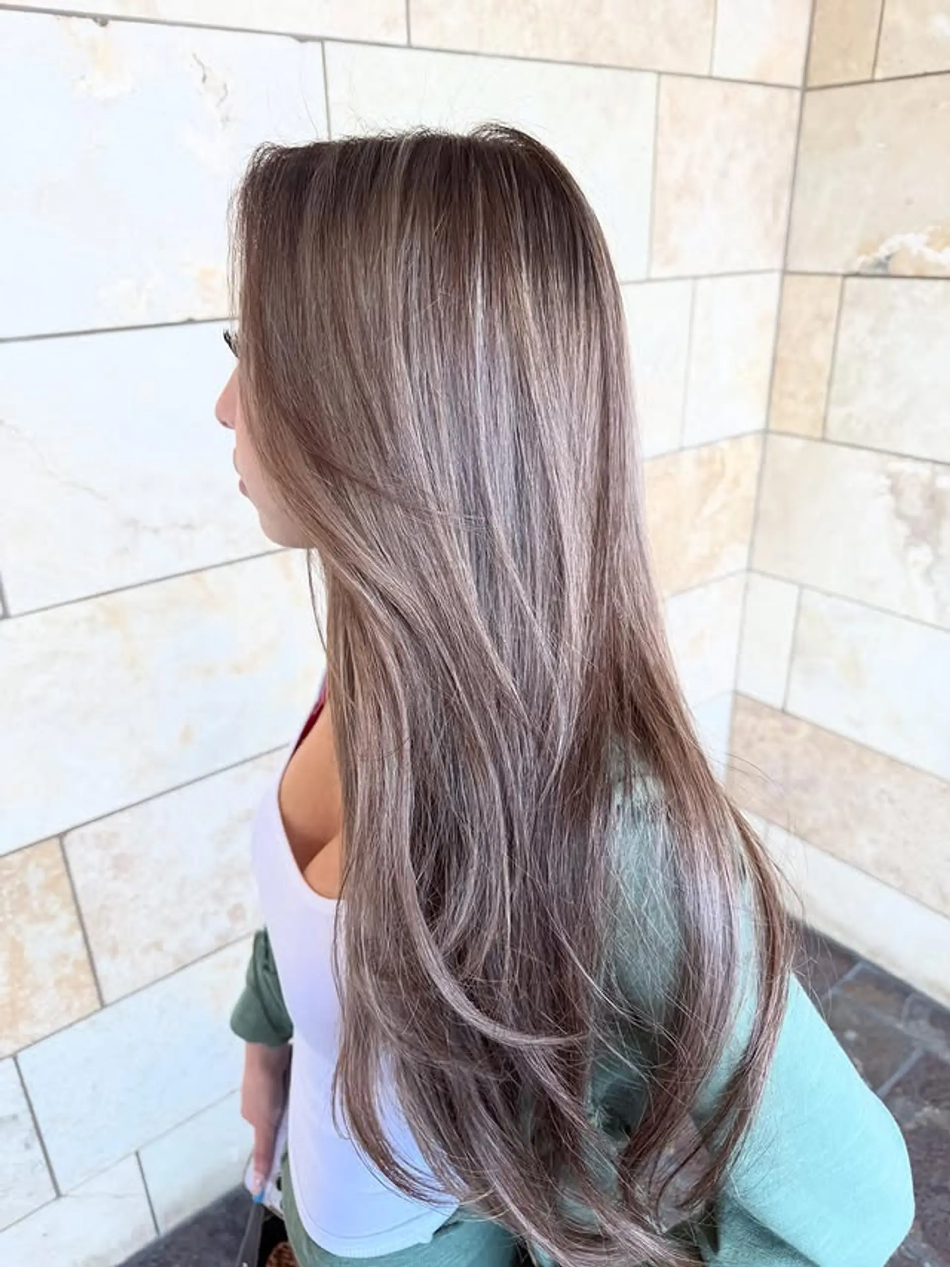 A long layered hairstyle with a bronde balayage. 1