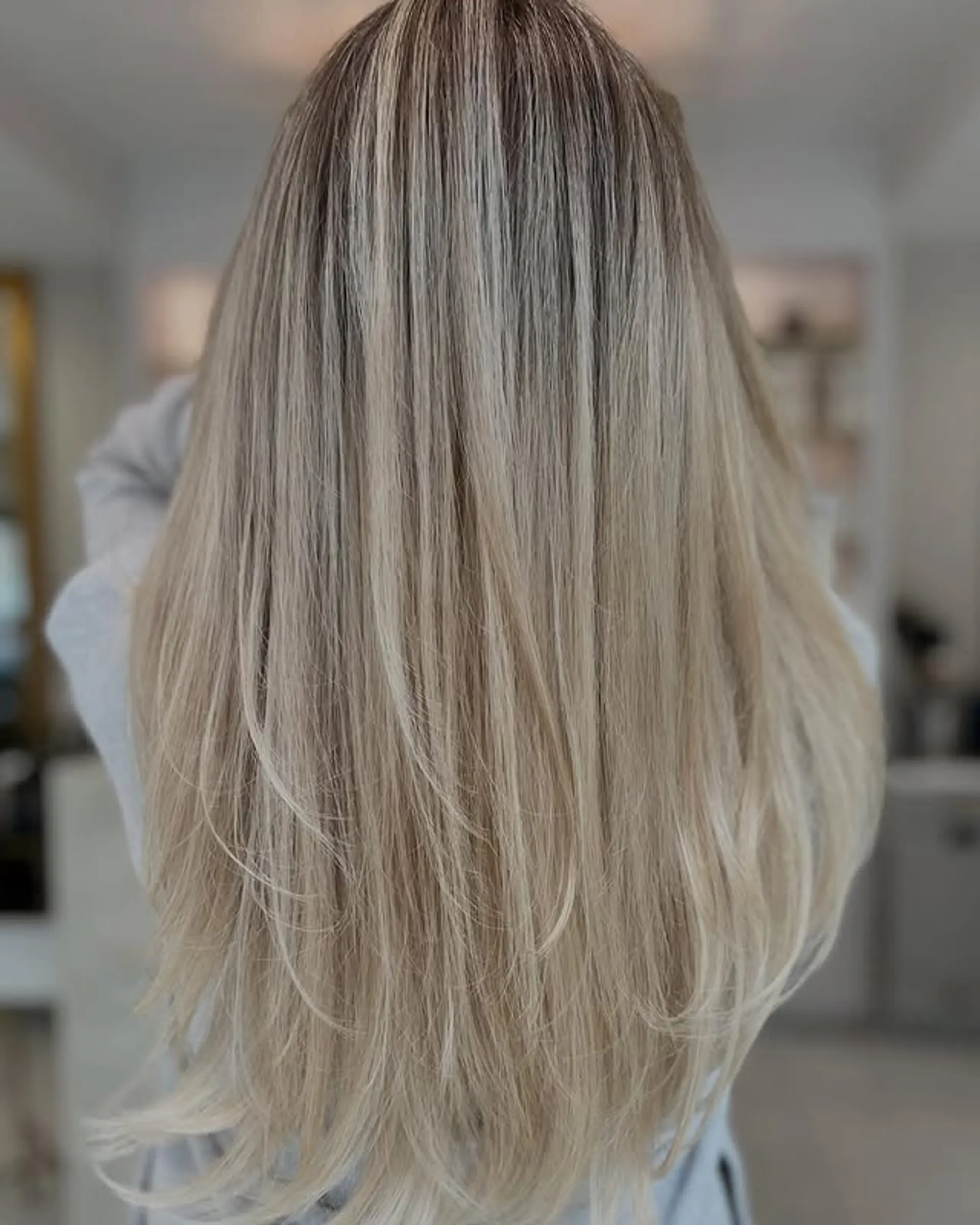 Long, layered hairstyle with a subtle balayage. 1