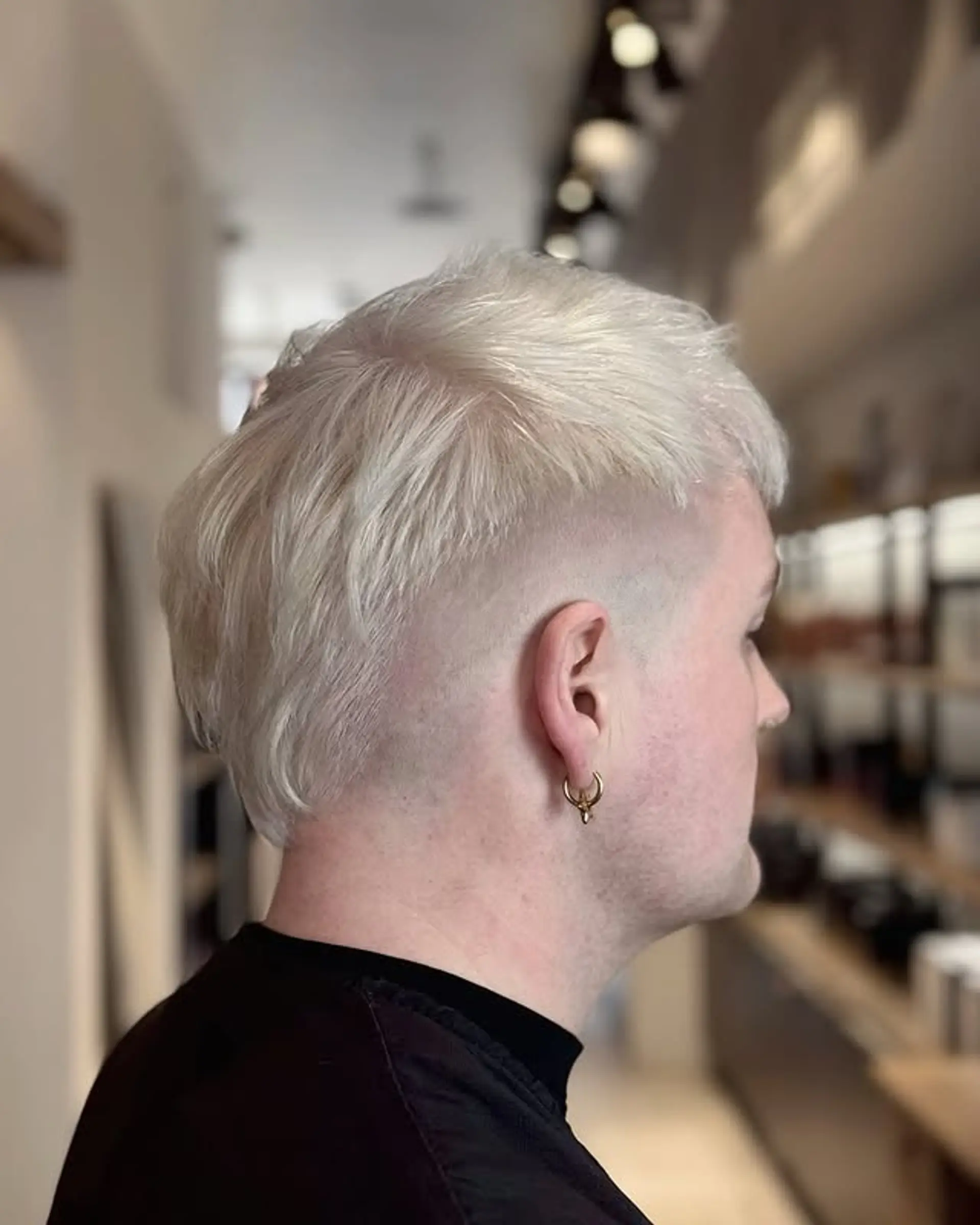 A modern take on the classic mullet featuring a fade on the sides and longer length in the back and on top. 1