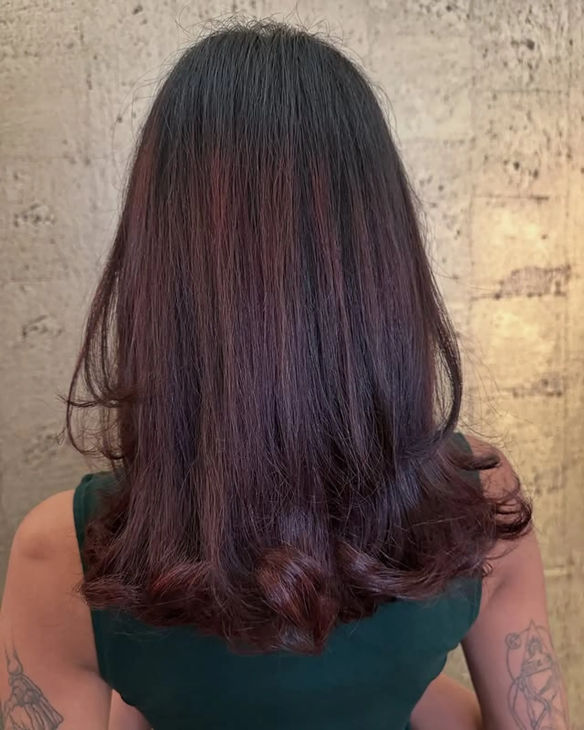 Layered medium-length haircut with subtle waves at the ends. 1