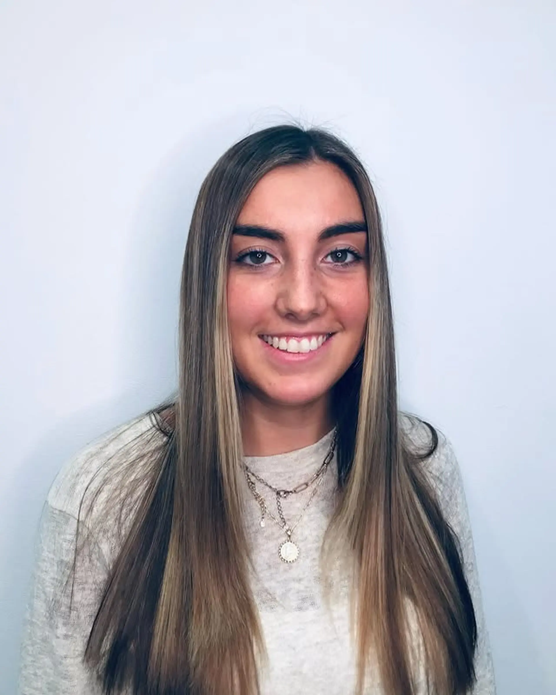 Long, layered hair with face-framing highlights. 1