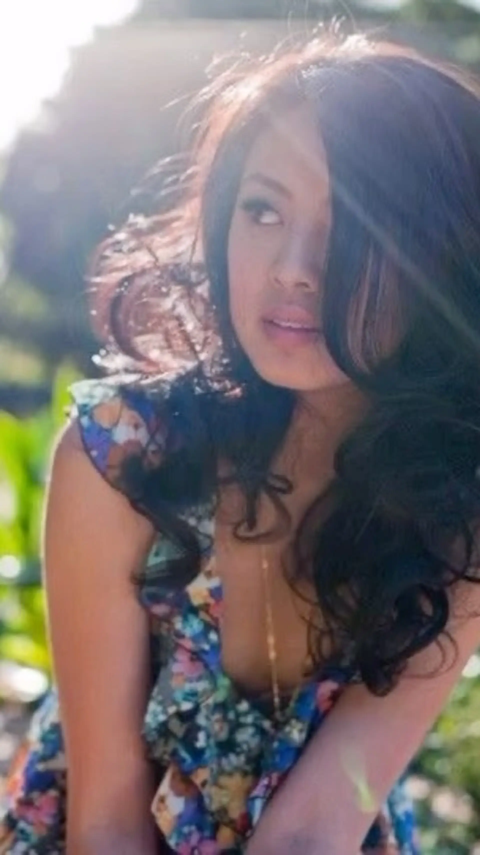 Long dark hair styled with soft, voluminous curls and a dramatic side part. 1
