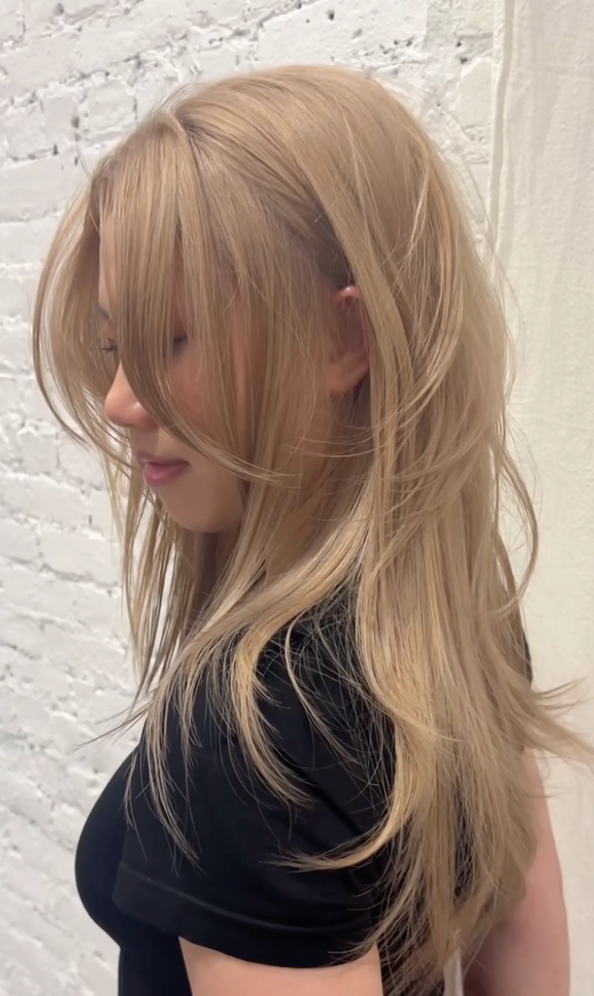 Long, wavy honey blonde hair with soft layers and face-framing strands. 1