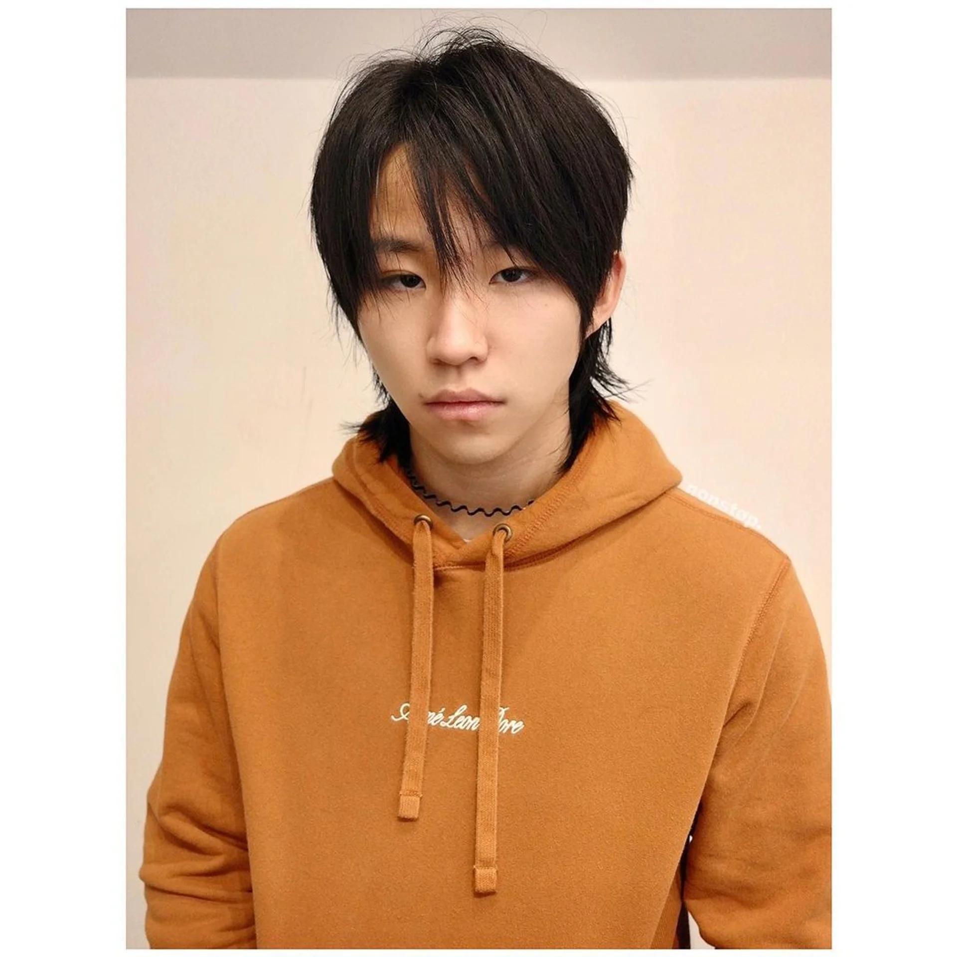 Dark brown, medium-length Wolf Cut with layered, wavy texture and tapered sides. - Preview 1