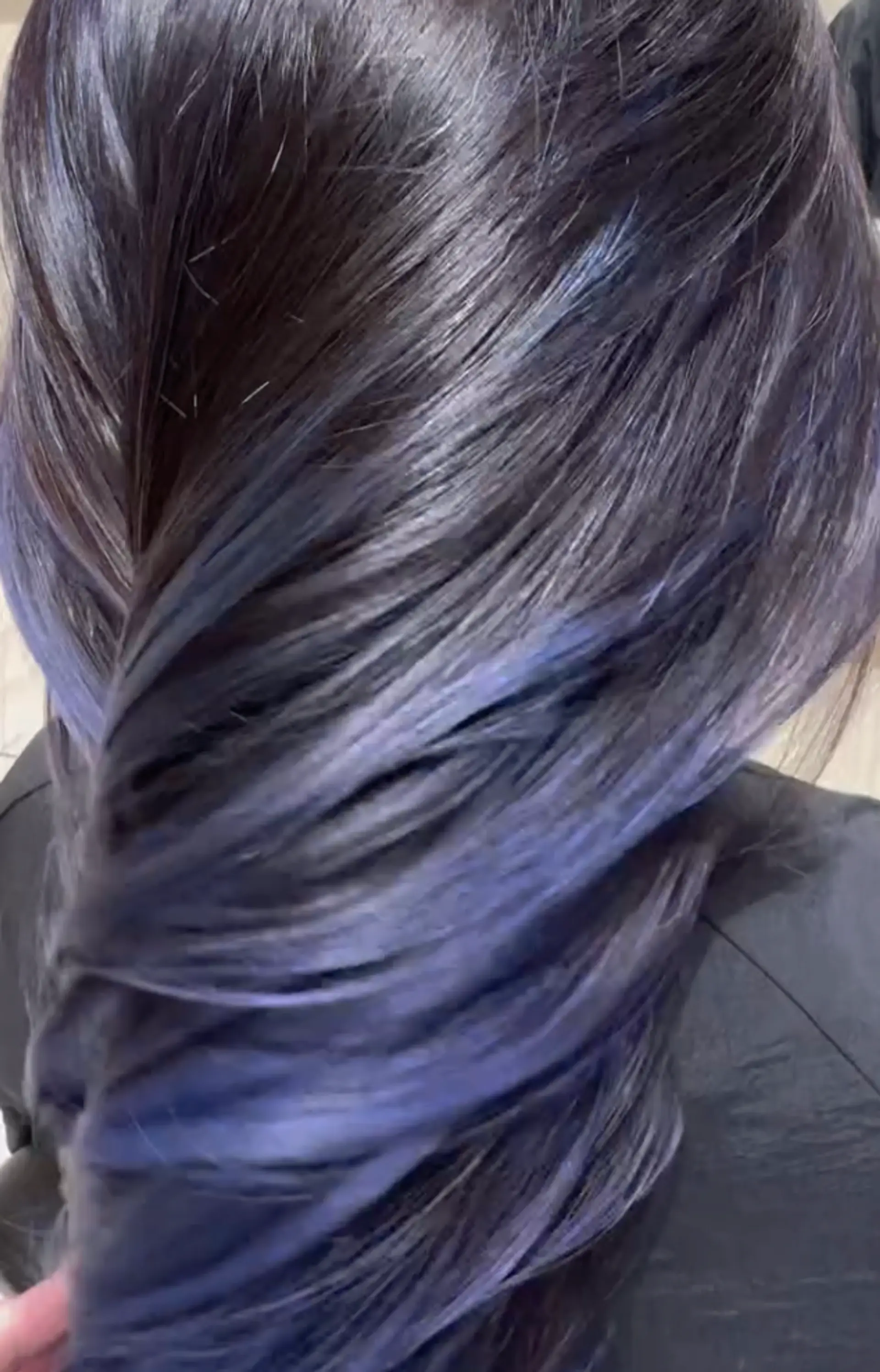 Long, straight hairstyle with an ombre transition from black to blue, featuring sleek and shiny layers. 2