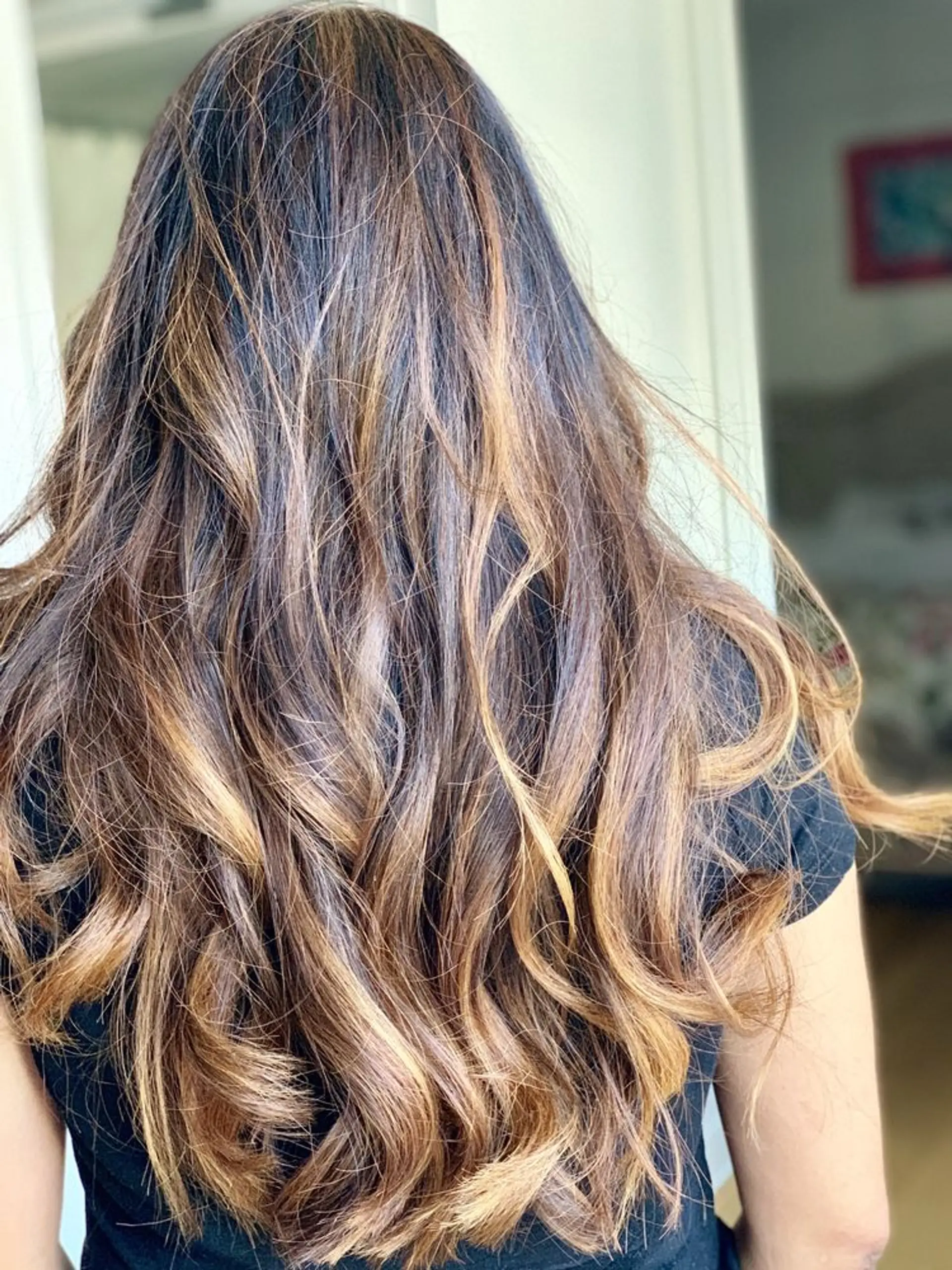 Long, wavy hair with a bronzed balayage. 1