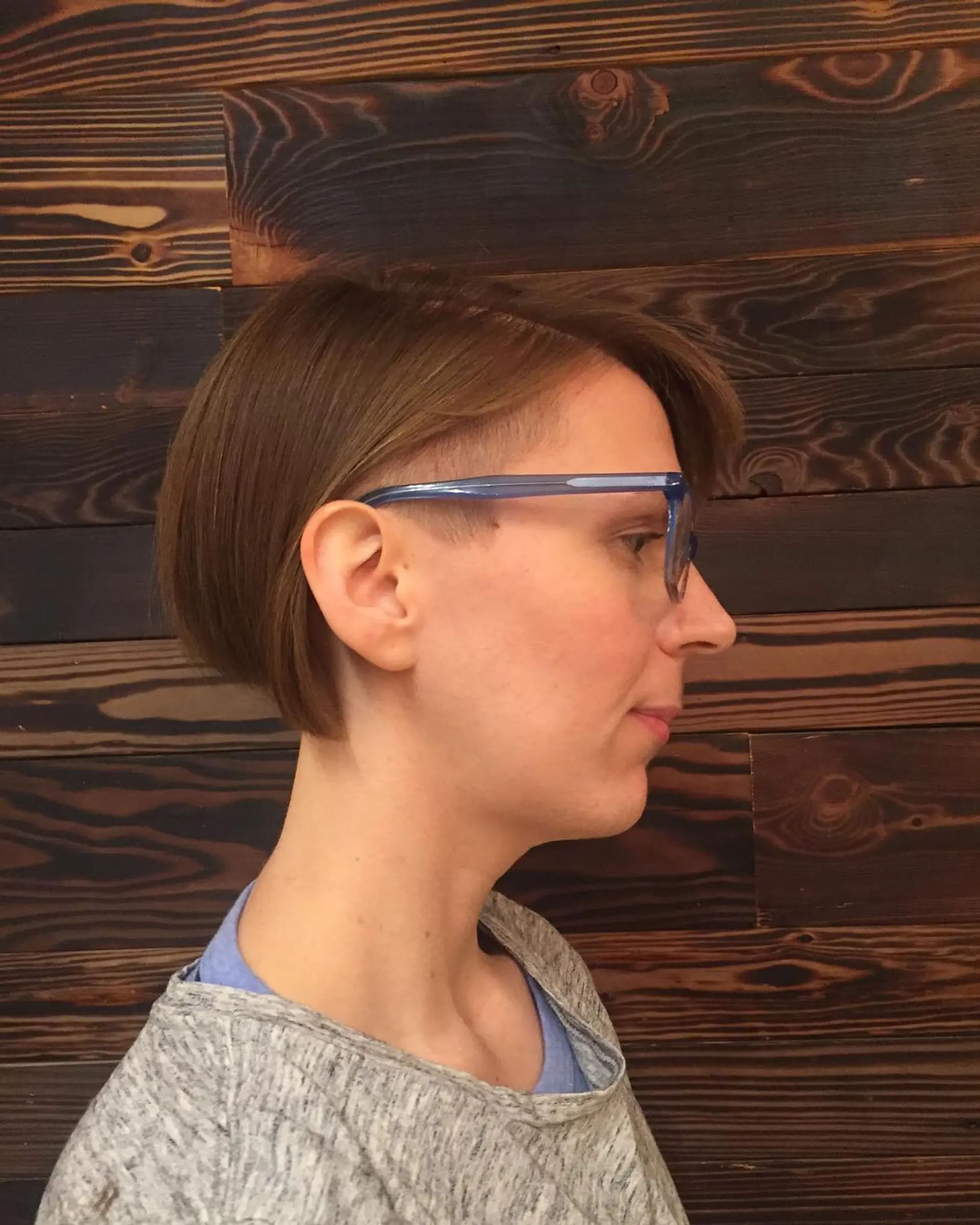 A short bob haircut with an undercut around the sides and back. 1