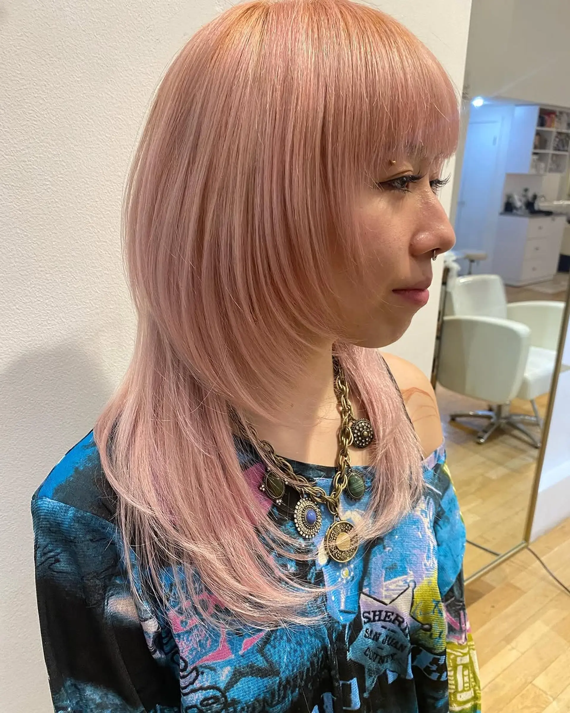 A trendy and edgy wolf cut with face-framing layers and bangs. 1