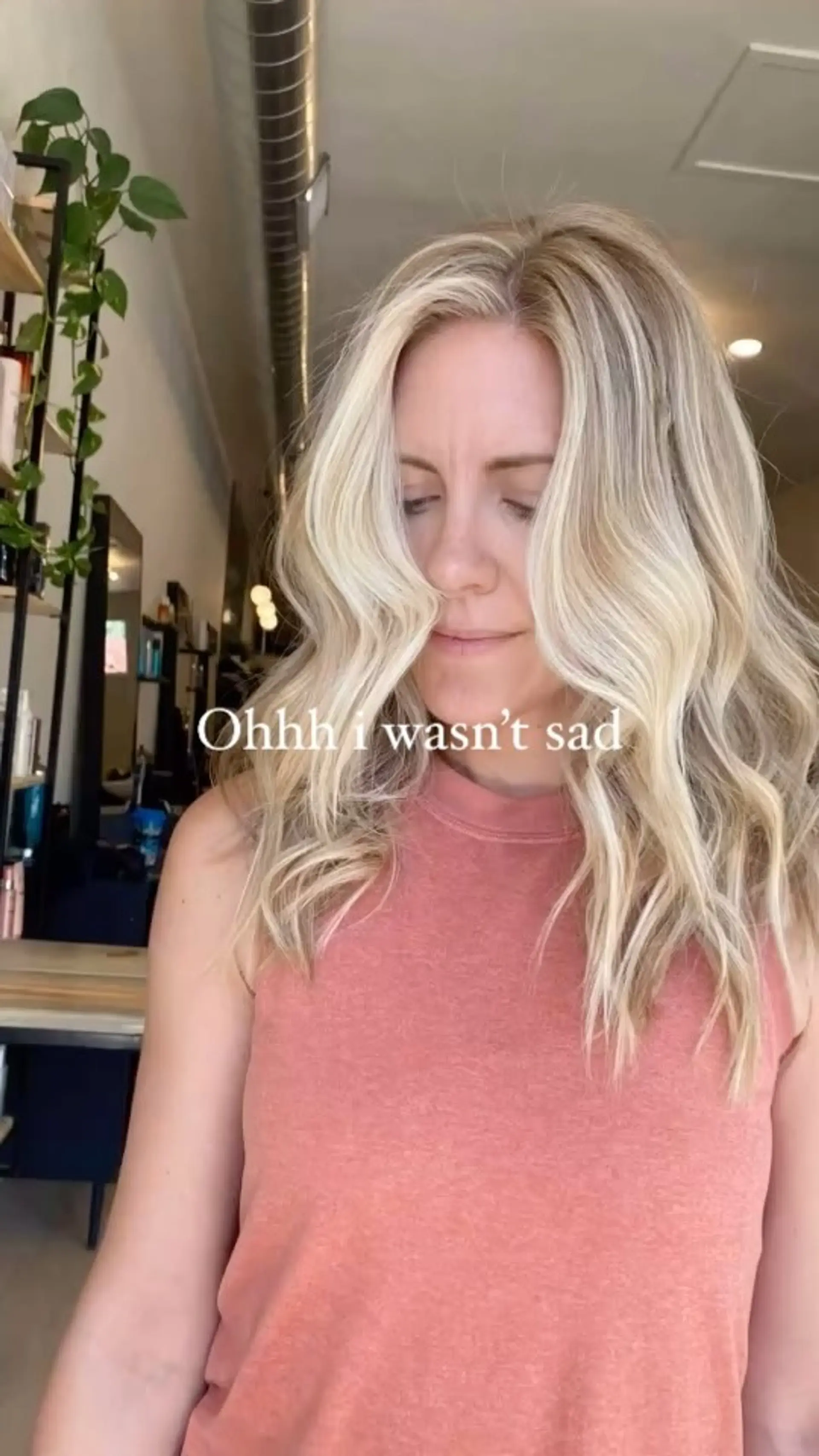 Long bright blonde hair styled with soft, dimensional waves and face-framing pieces. 1