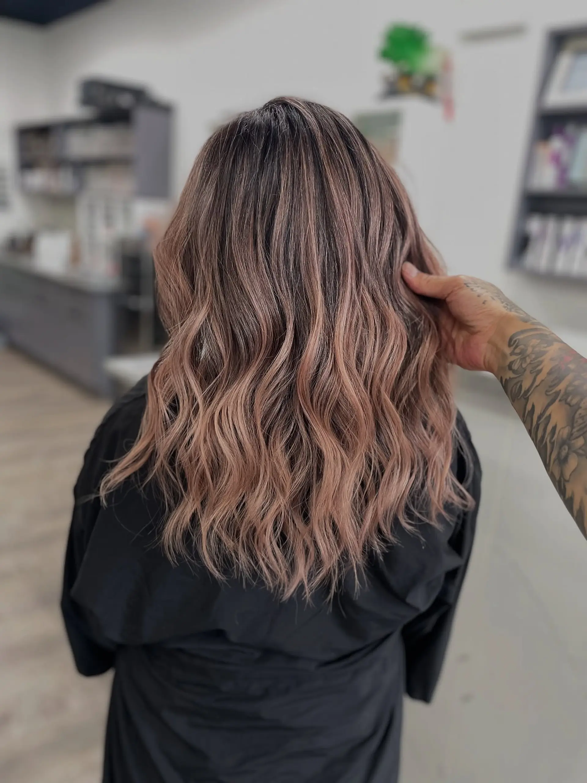 Medium length wavy hair with balayage rose gold color. 1