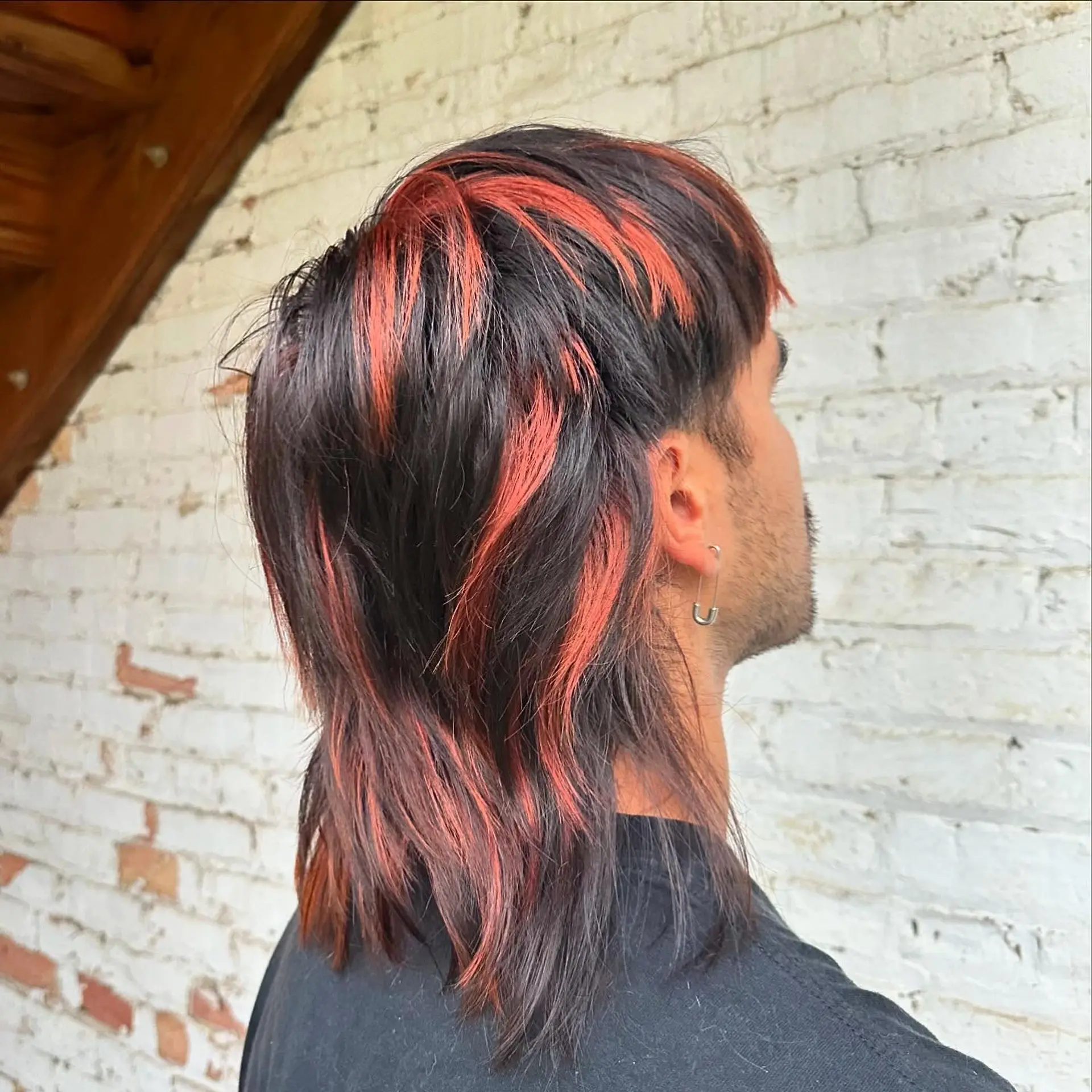 A trendy mullet with choppy layers and bold highlights. 1
