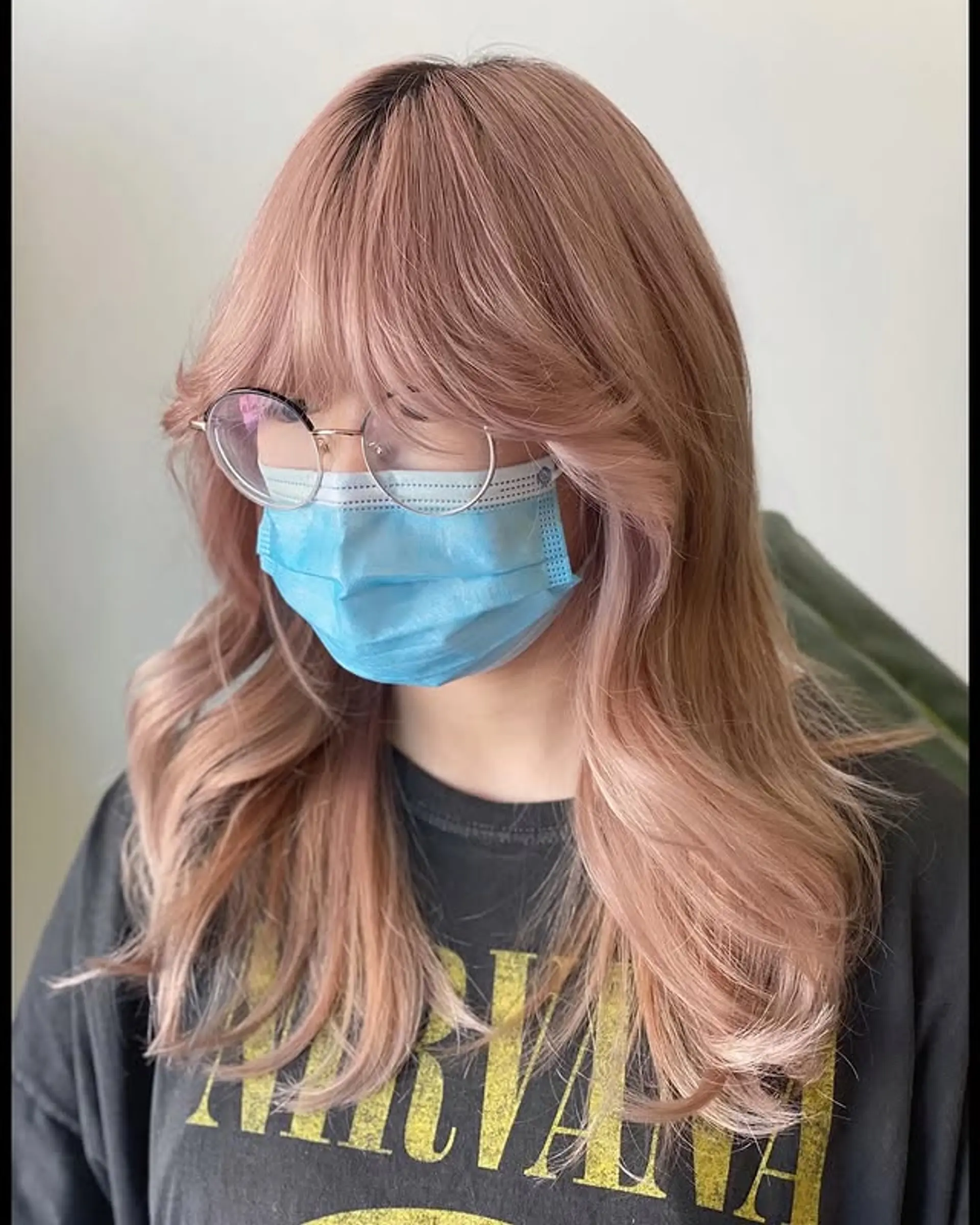 A trendy layered bob with face-framing layers and soft curtain bangs. 1