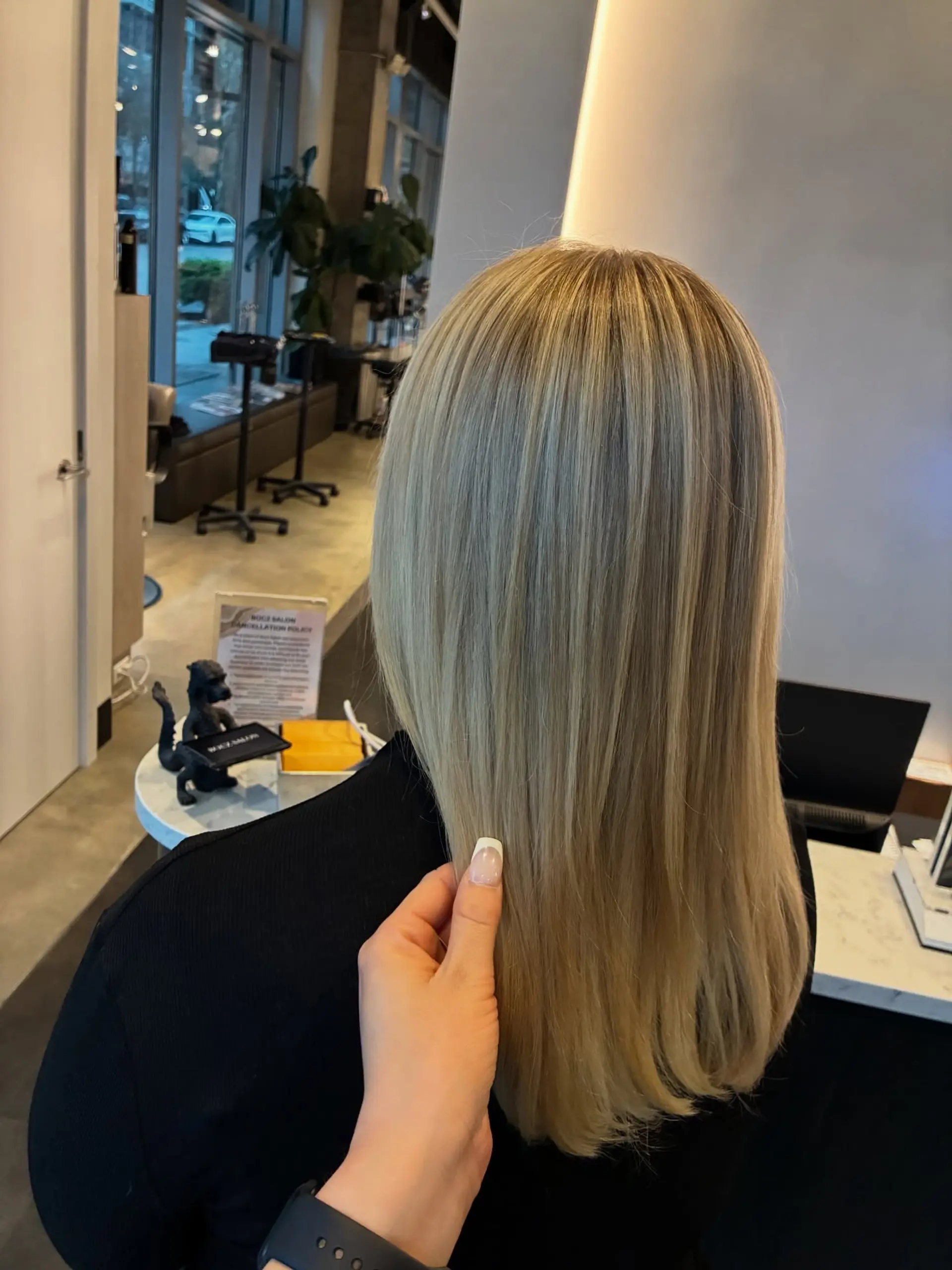 Straight, smooth ash blonde hair with seamless dimensional highlights and a clean, glossy finish. 1