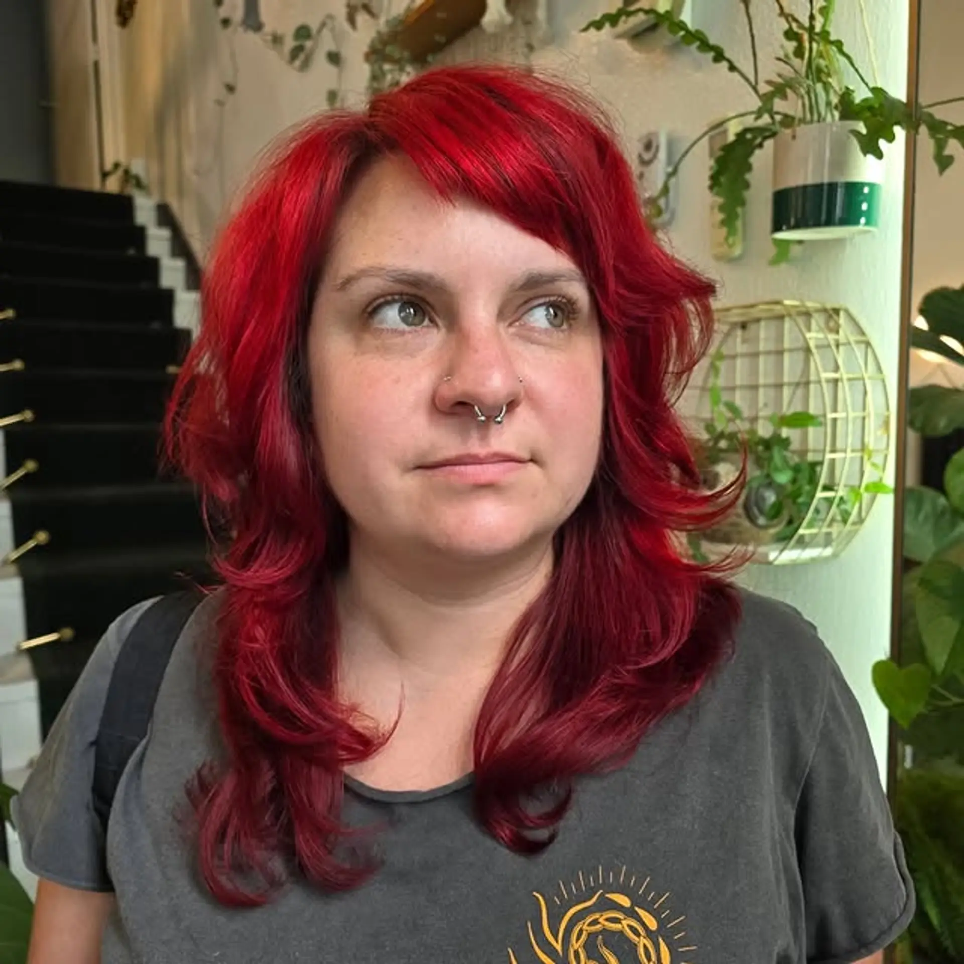 Medium-length wavy hair with choppy bangs and face-framing layers. 1