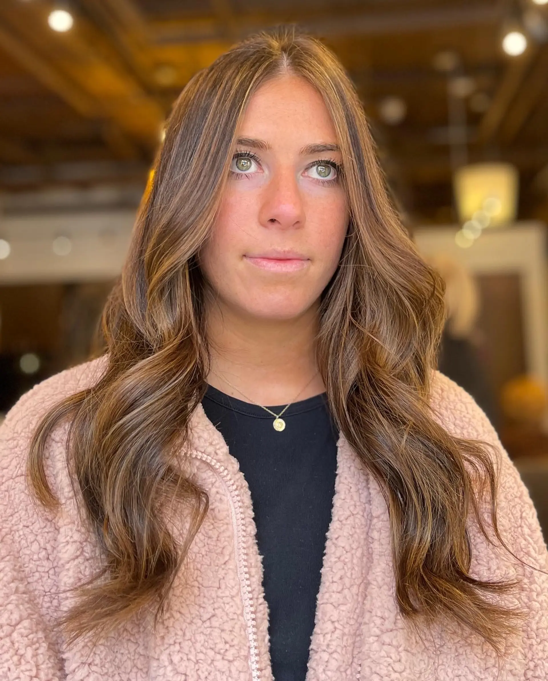 Long, layered hairstyle with caramel highlights. 1