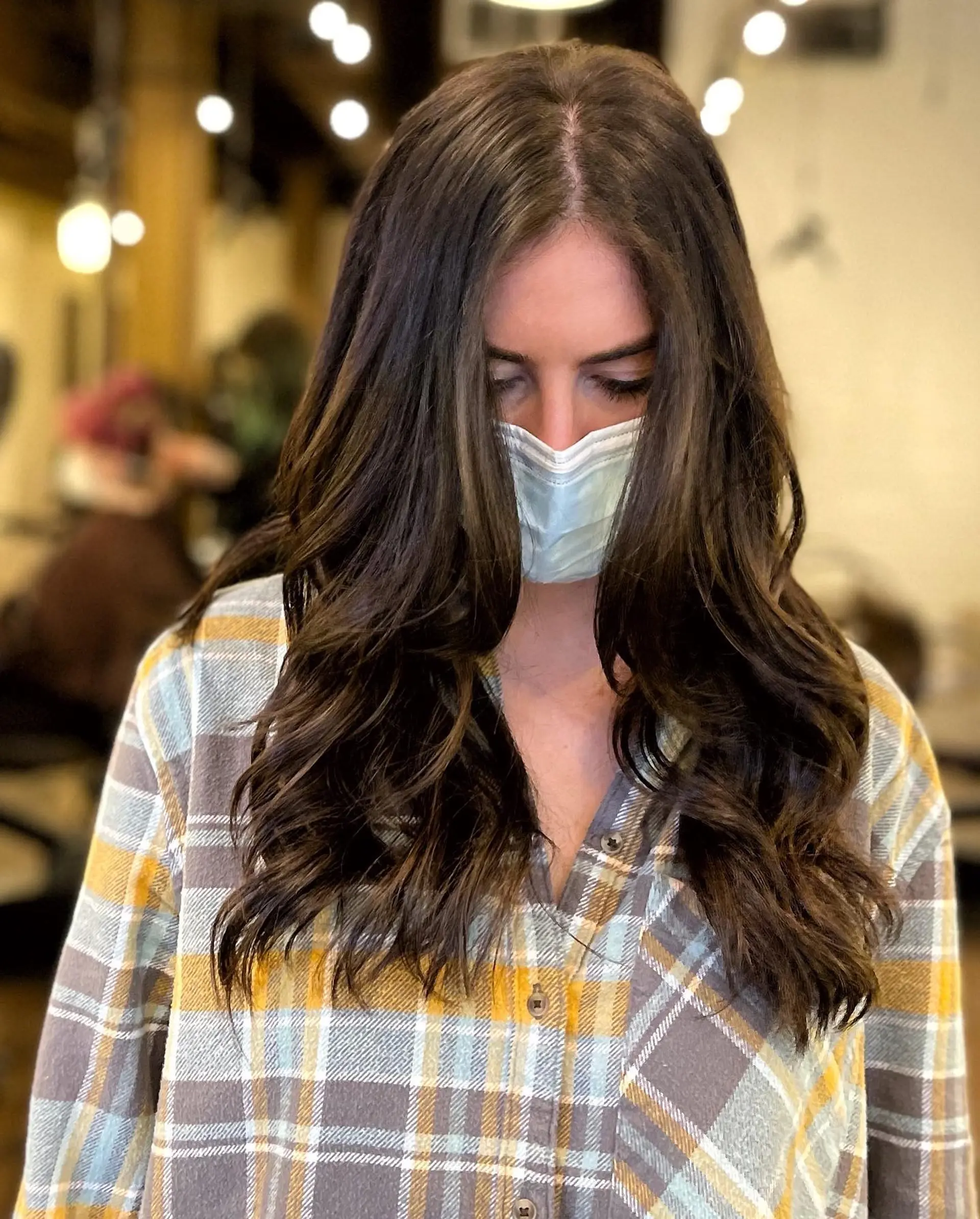 Long, layered hairstyle with caramel highlights. 2