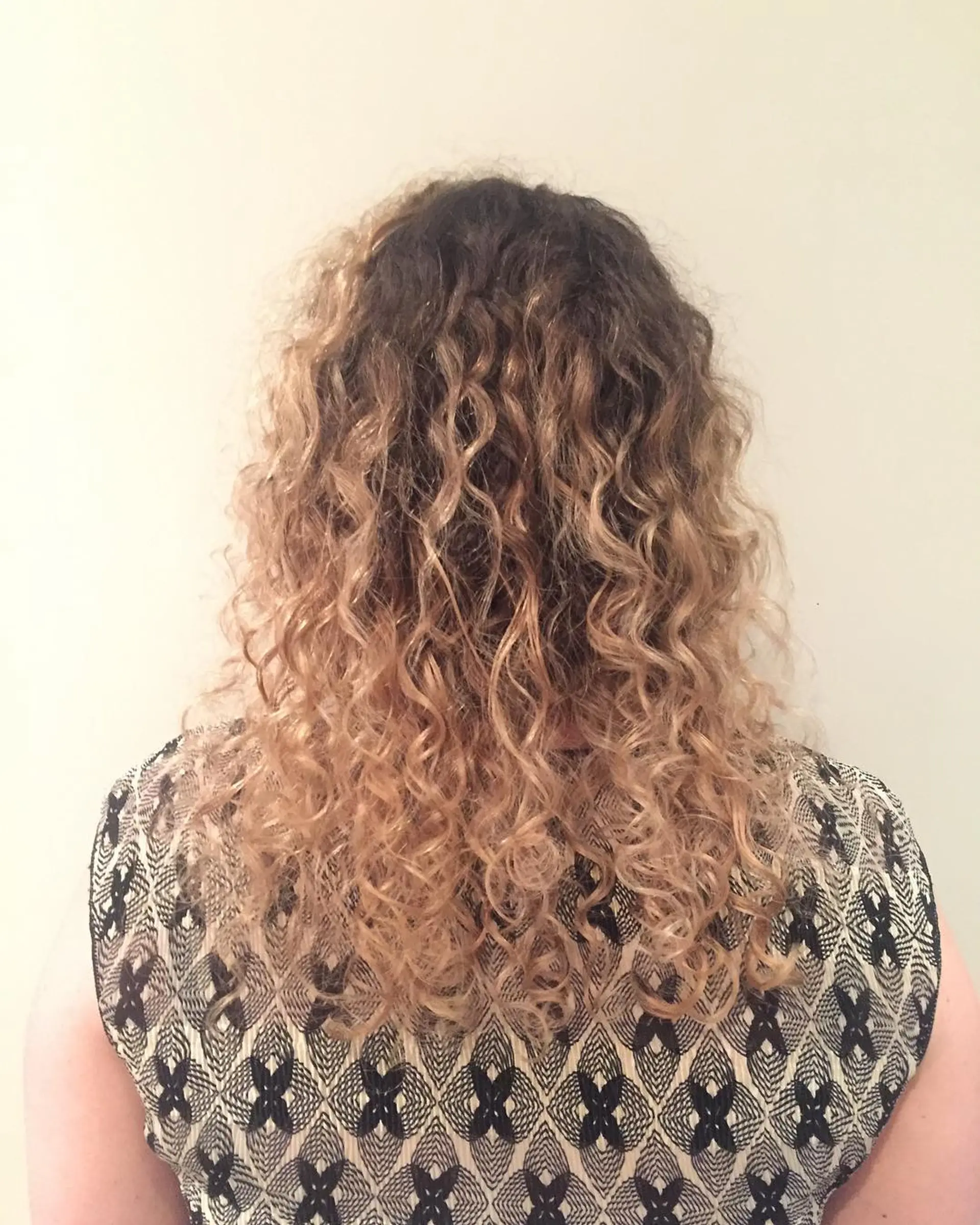 Medium-length curly hair with a brown to blonde ombre. 1
