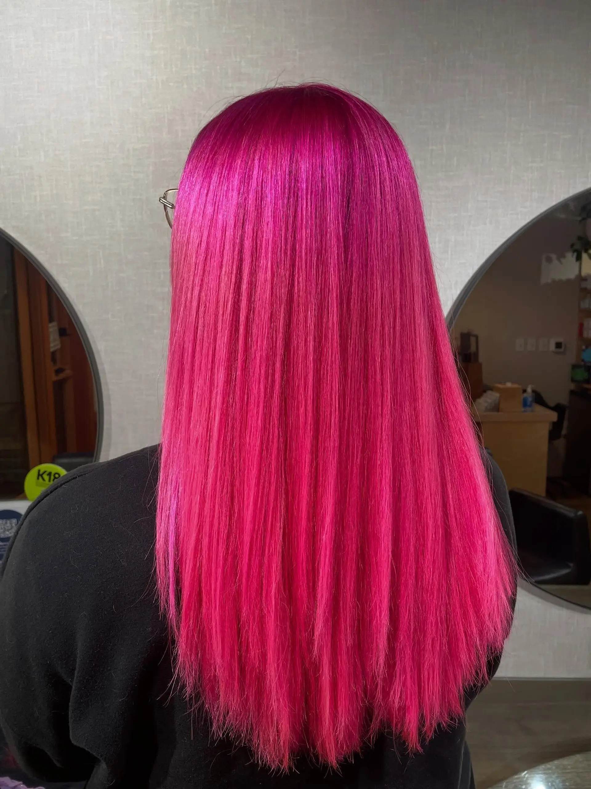 Vivid hot pink long hair styled completely straight, featuring a smooth, sleek finish. 1