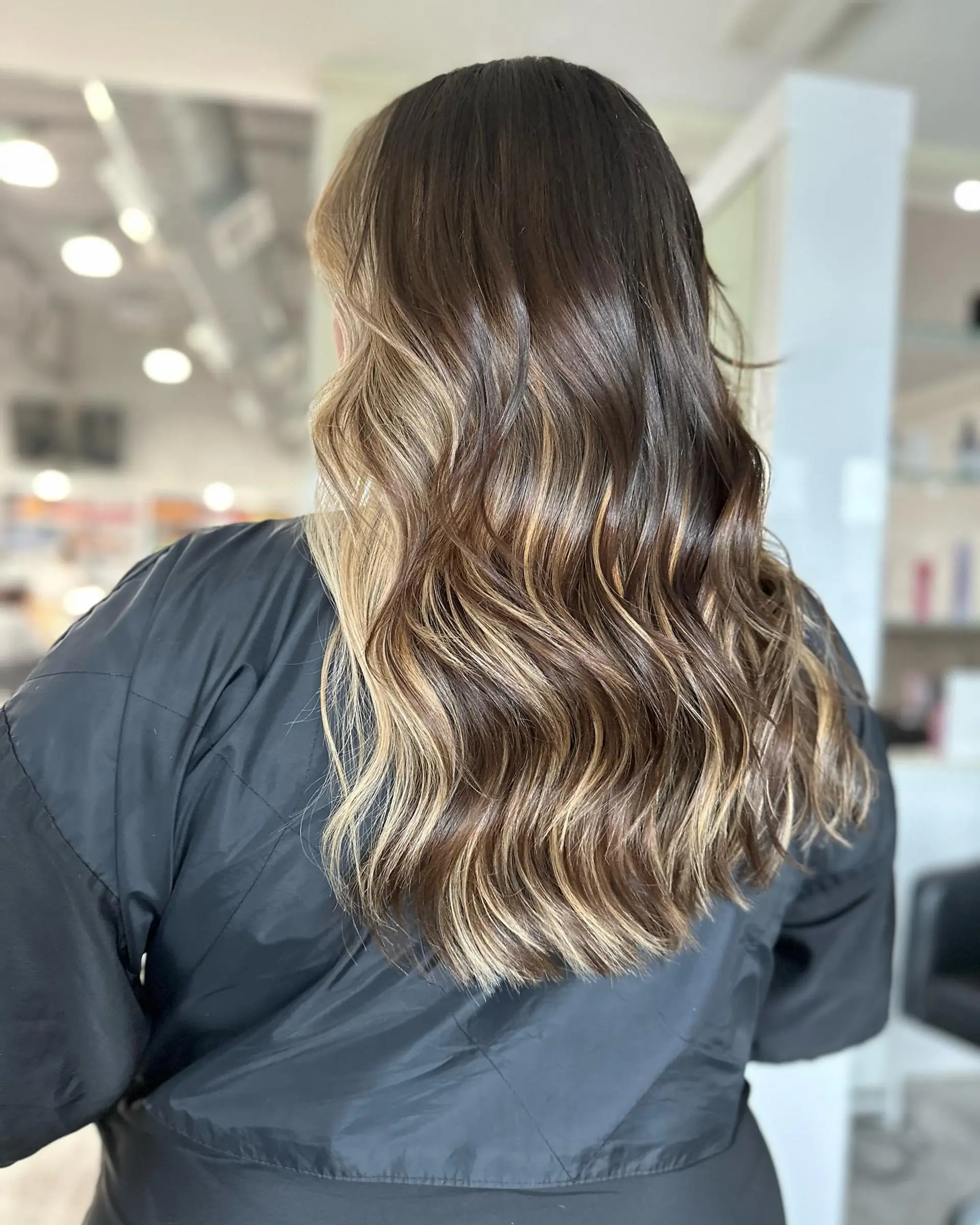 Long wavy hair with a caramel balayage. 2