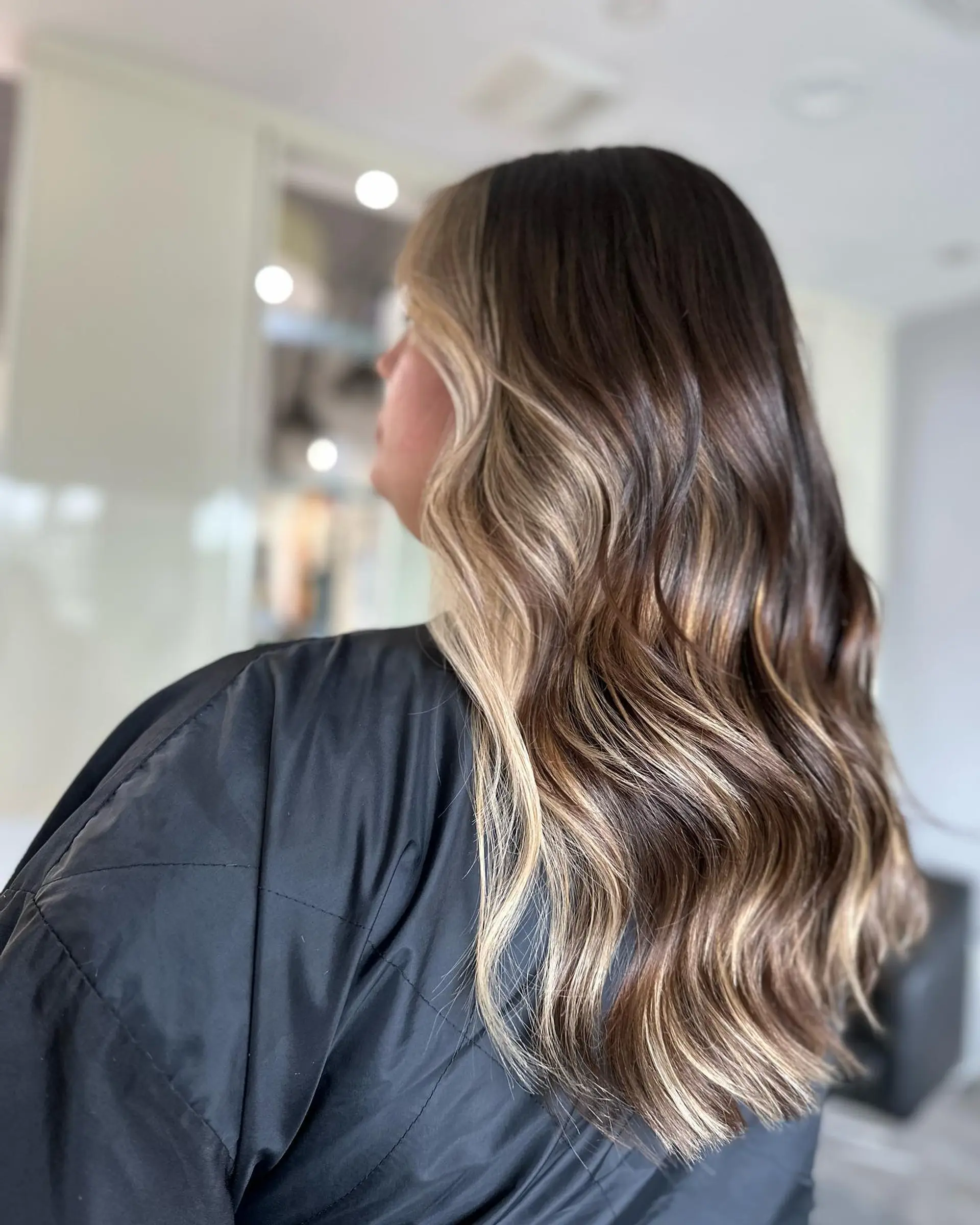 Long wavy hair with a caramel balayage. 3