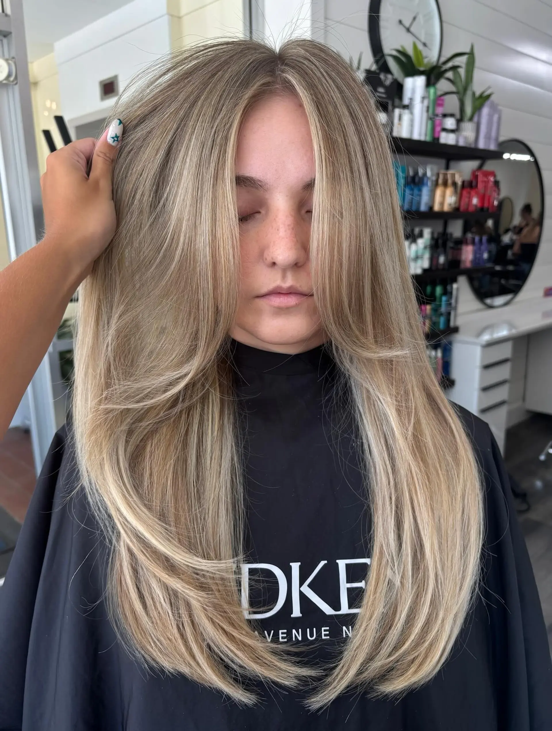 Long straight hair with dimensional vanilla blonde highlights and soft, curved face-framing layers. 1