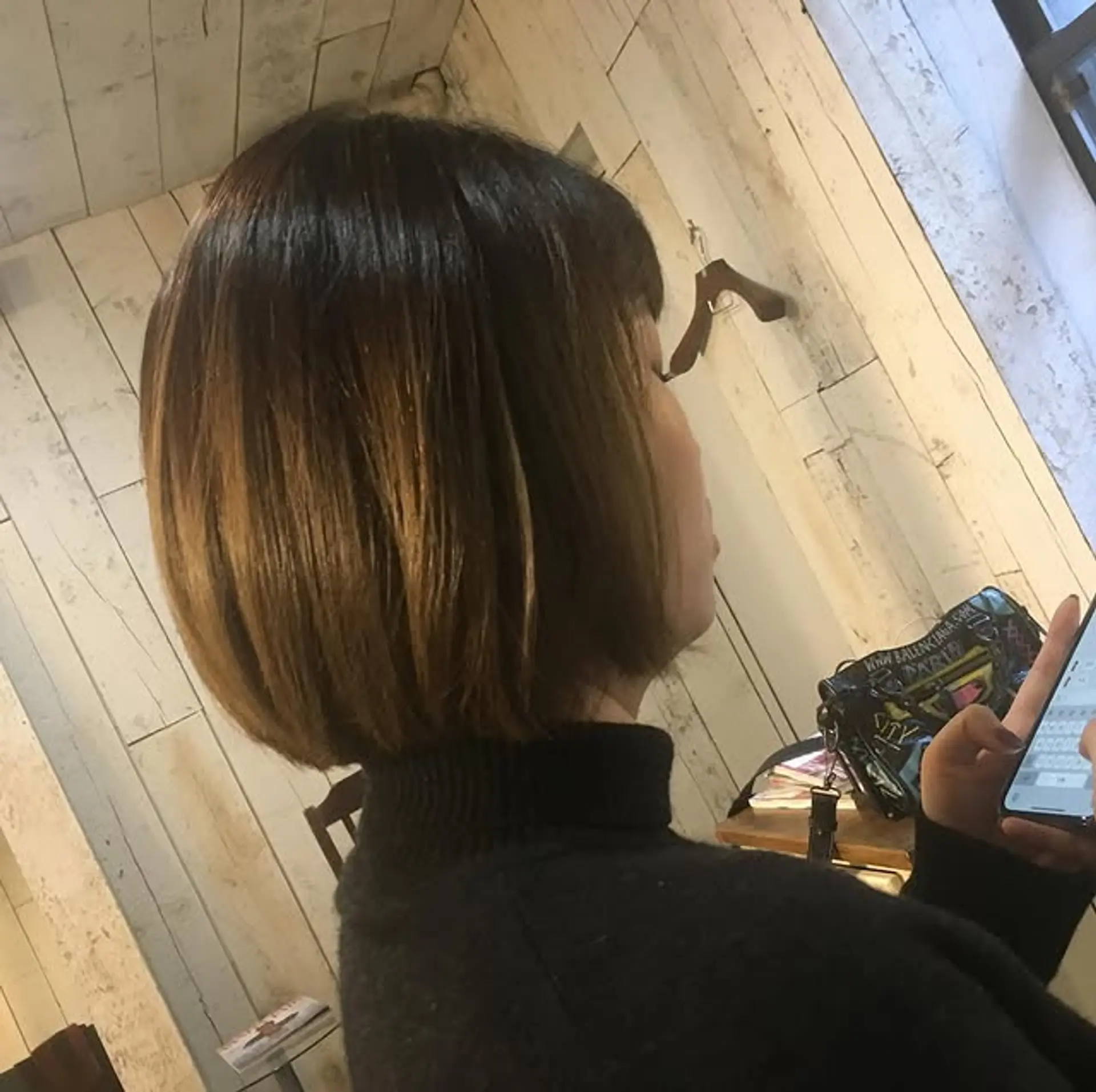 A chin-length blunt bob with face framing bangs. 1