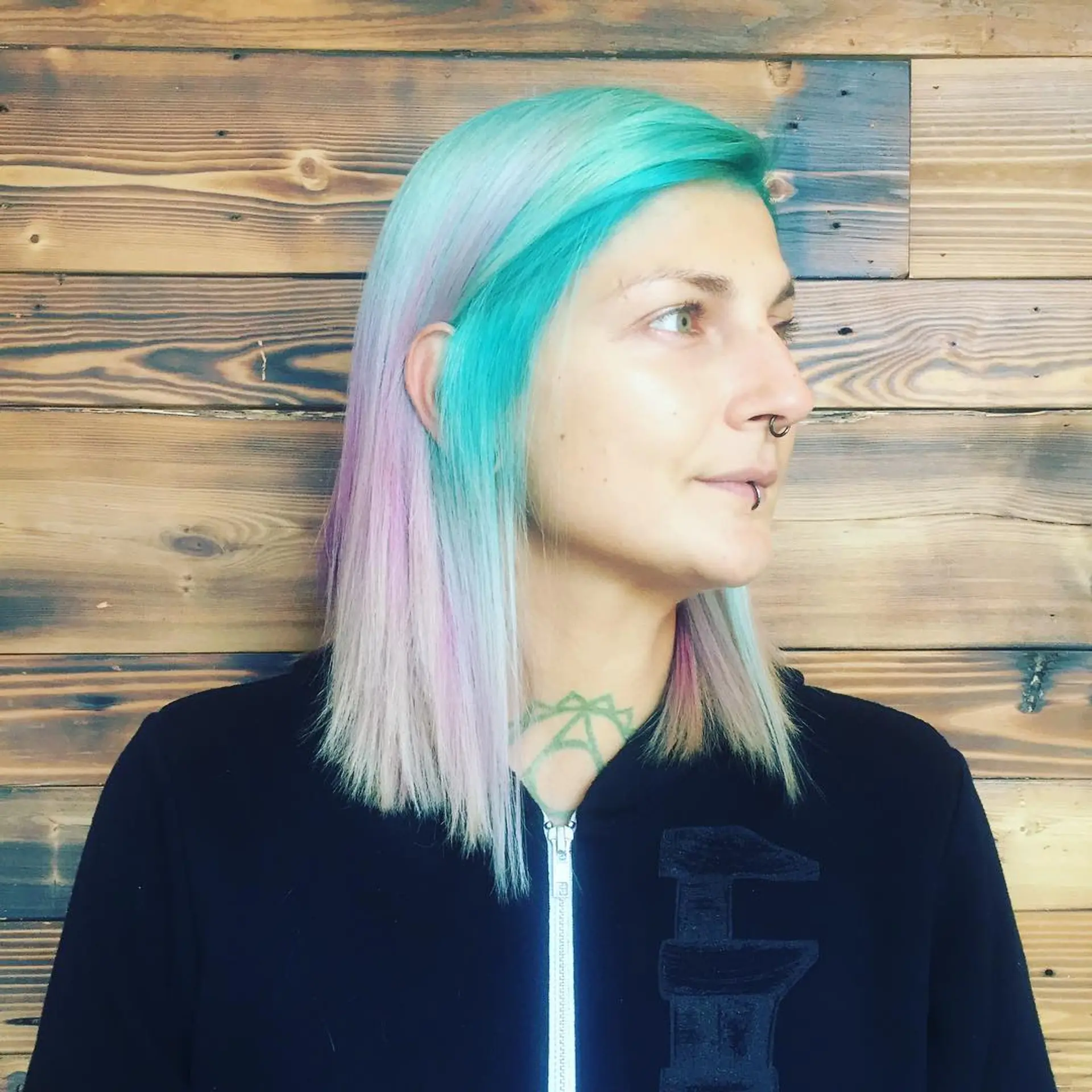 A straight bob haircut with a dip-dye effect in pastel colors including turquoise, pink, and lavender. 1