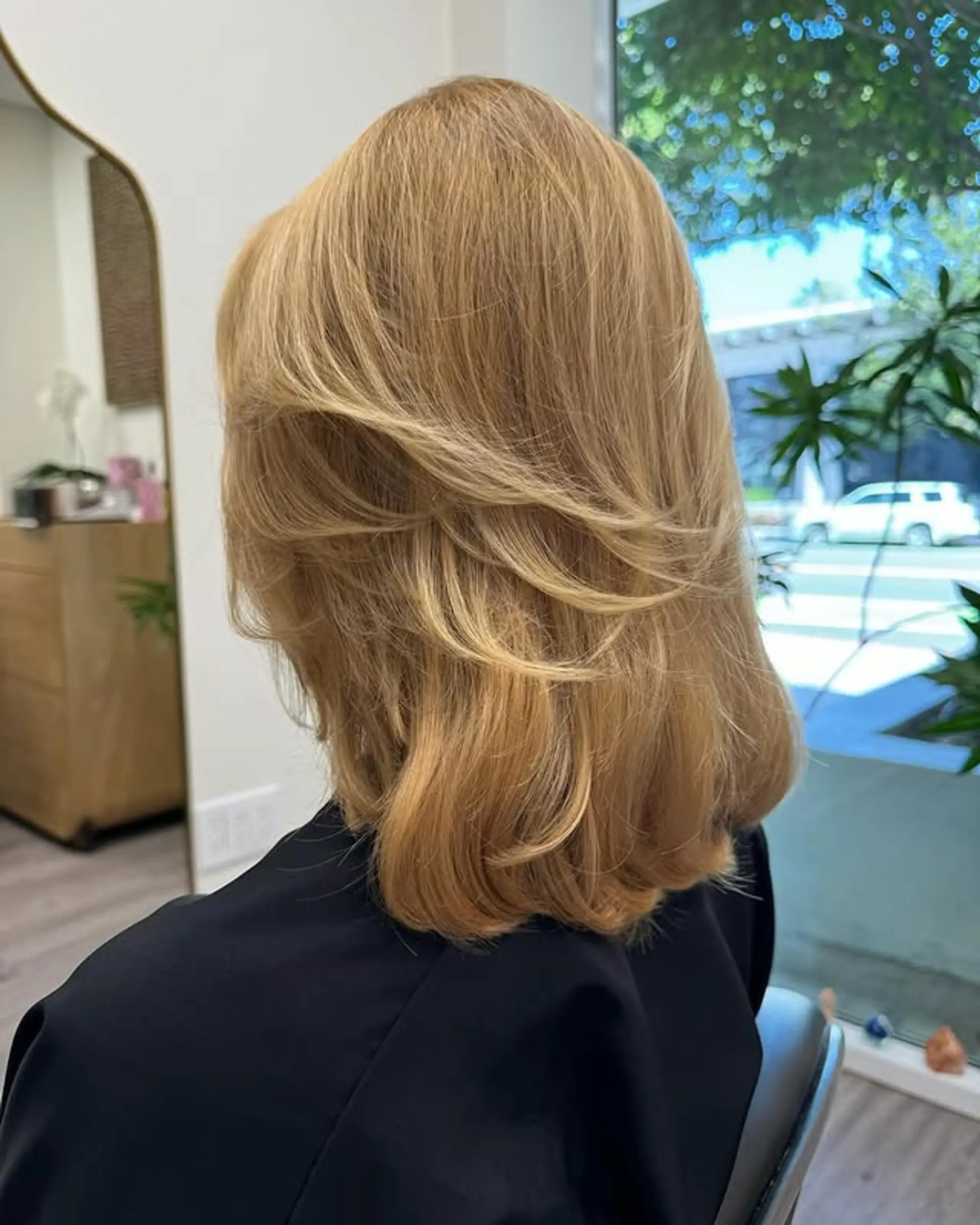 A layered bob with flipped, face-framing layers. 1