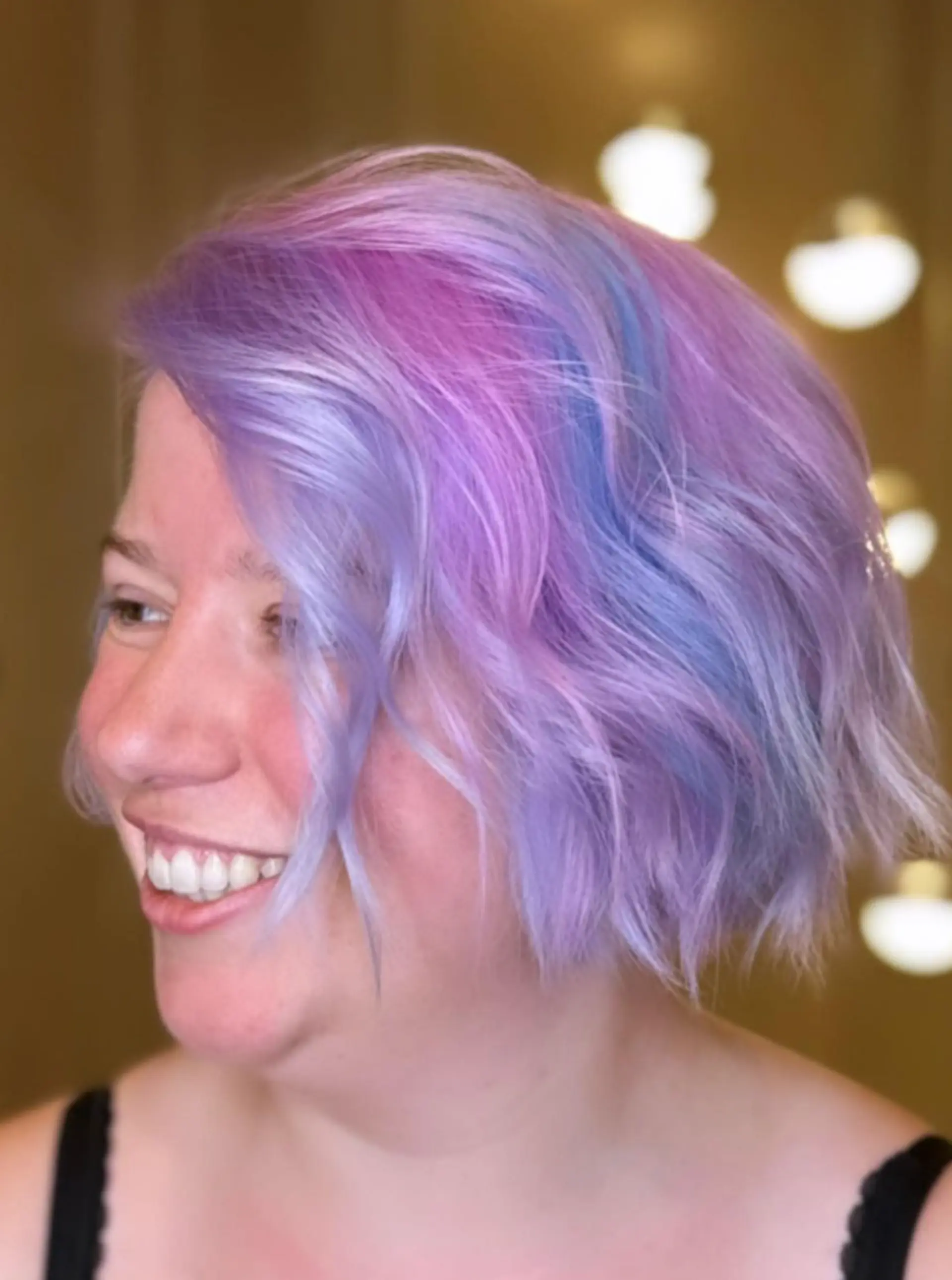 Short, wavy bob with pastel pink, blue, and purple hues; multi-dimensional and whimsical look. 2