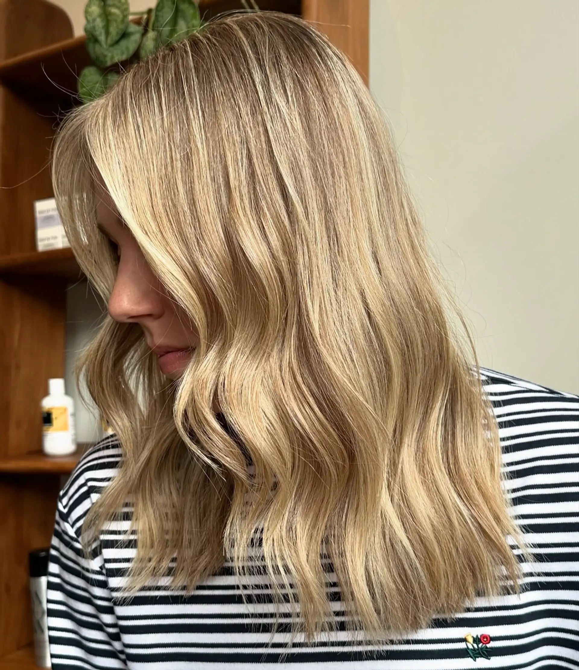 Beachy wavy hair with face-framing layers. 1