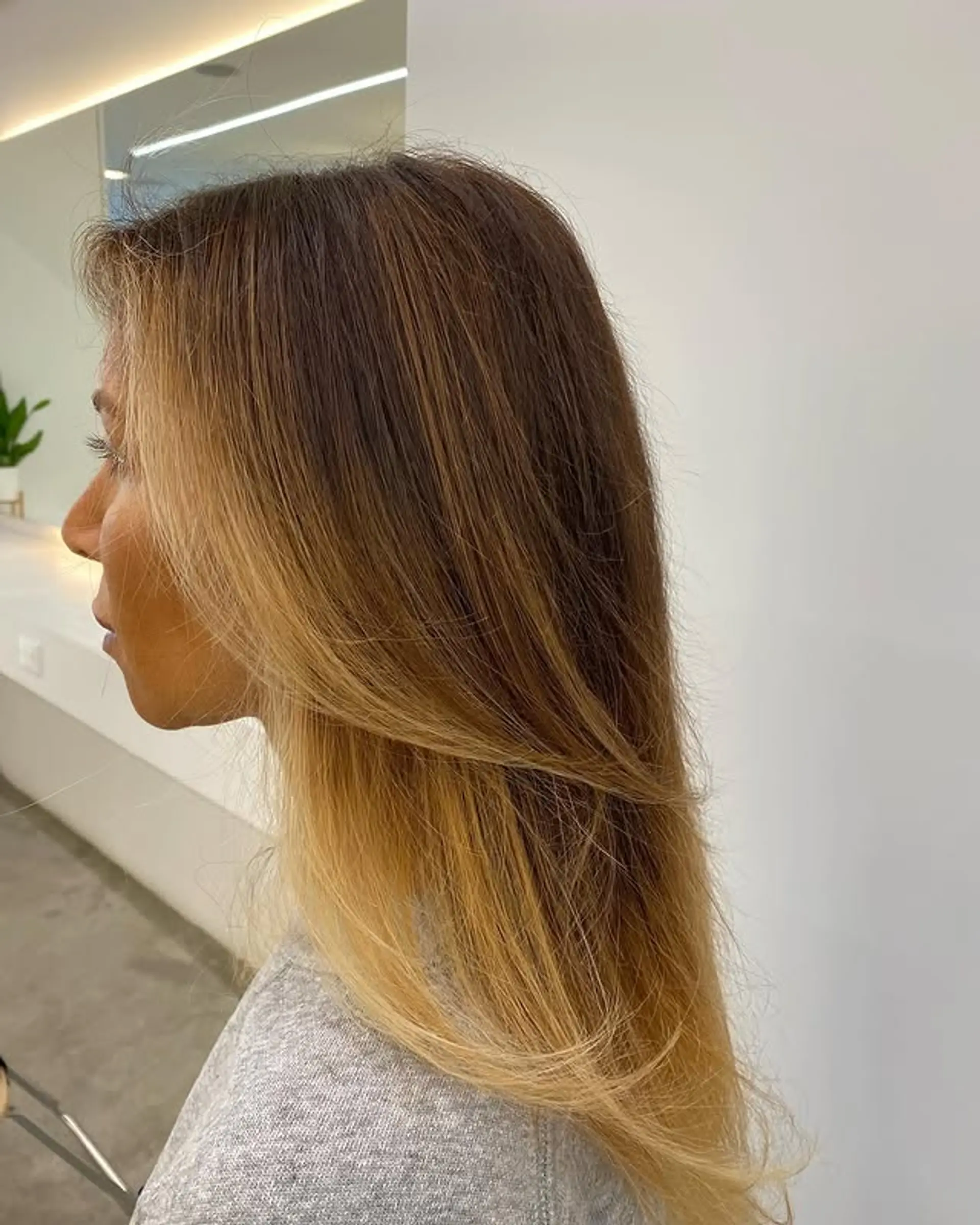 A long, layered haircut with ombre color. 1
