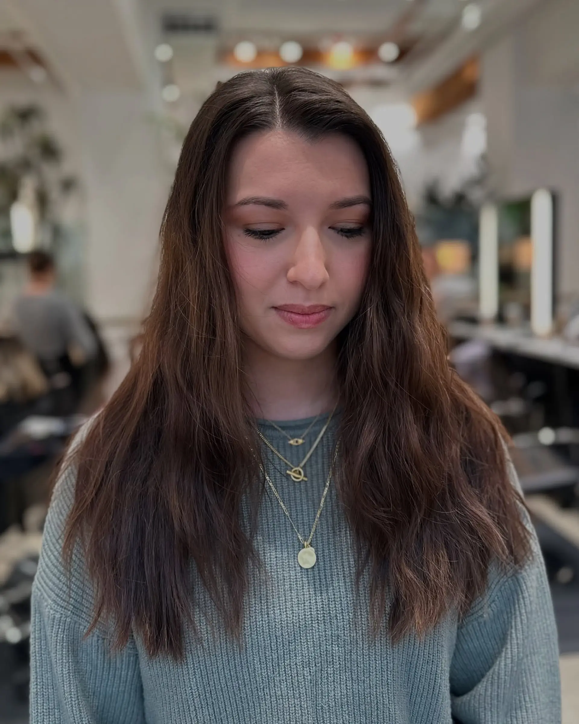 A long, layered cut with a bronde balayage, creating a soft, wavy and dimensional style. 3