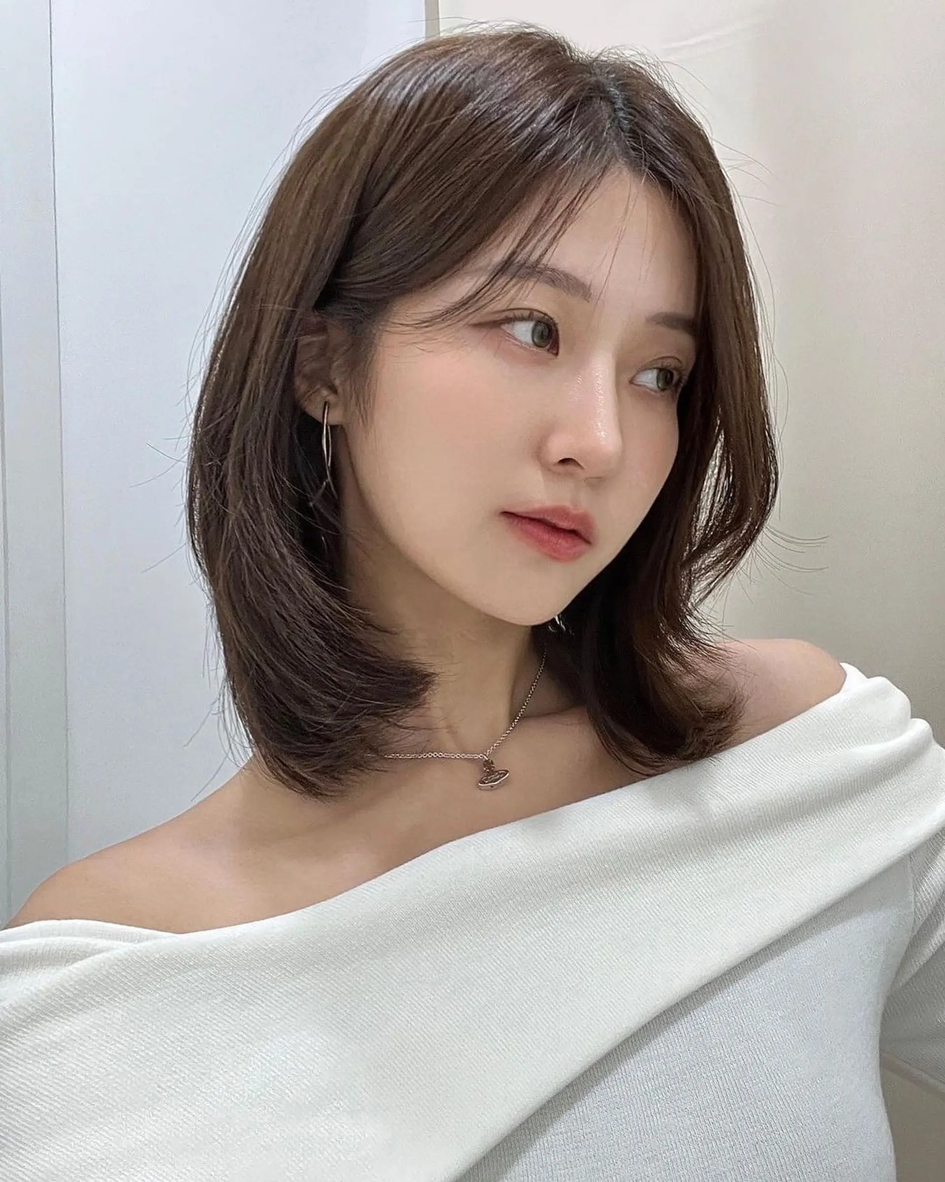 A chic, shoulder-length bob with soft, subtle waves. 1