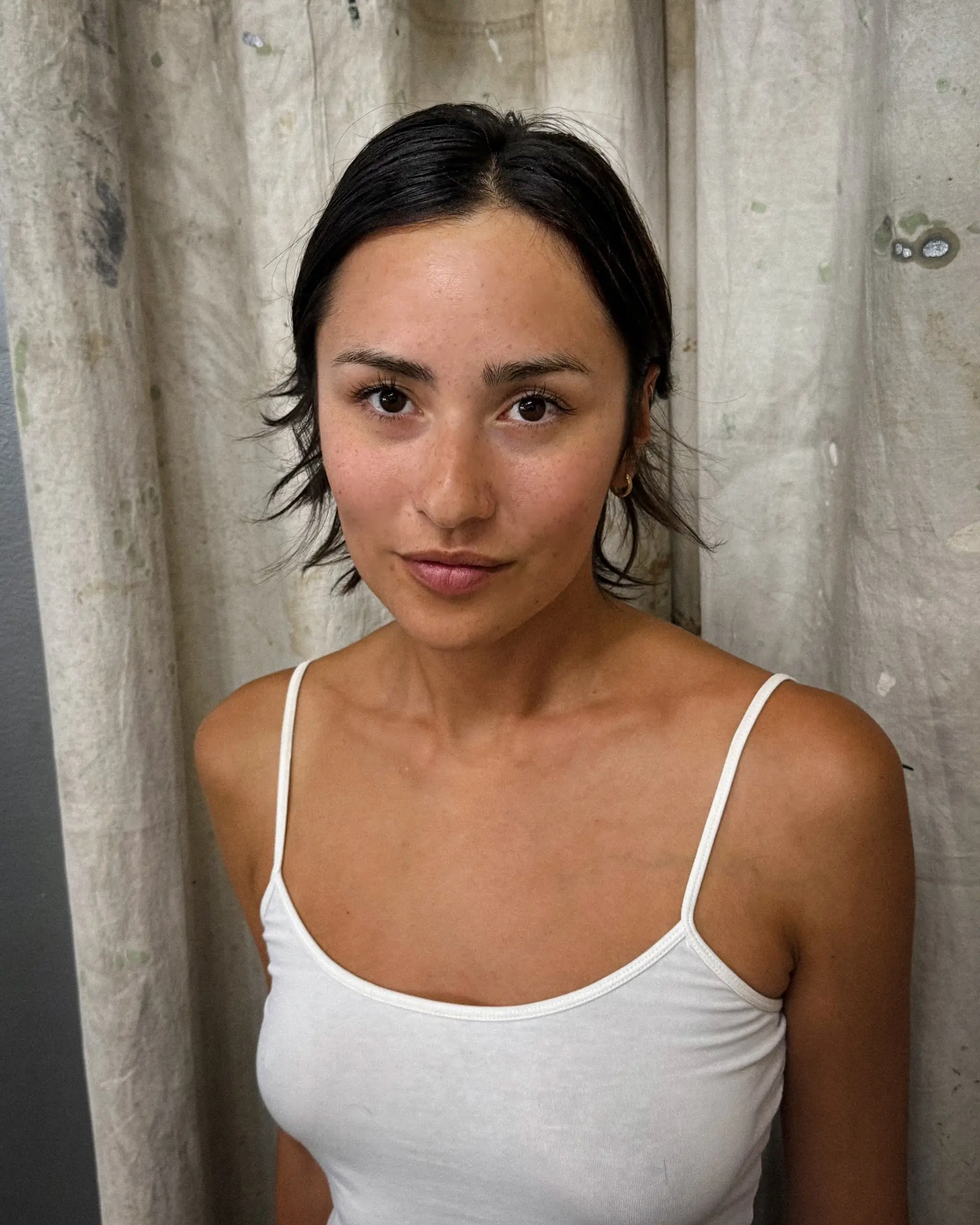 A choppy bob haircut that sits at chin length with textured ends and plenty of layers. 1