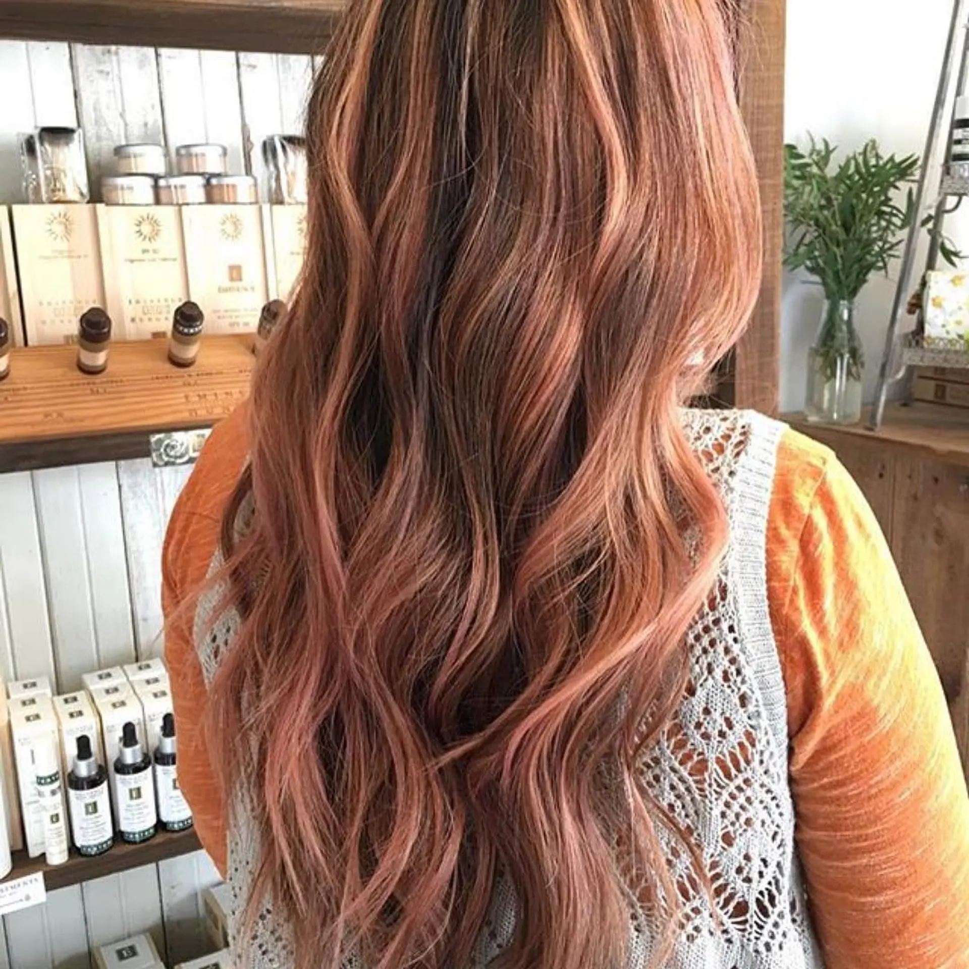 Long, soft layered waves showcasing a dimensional rose gold balayage over a warm base. 1