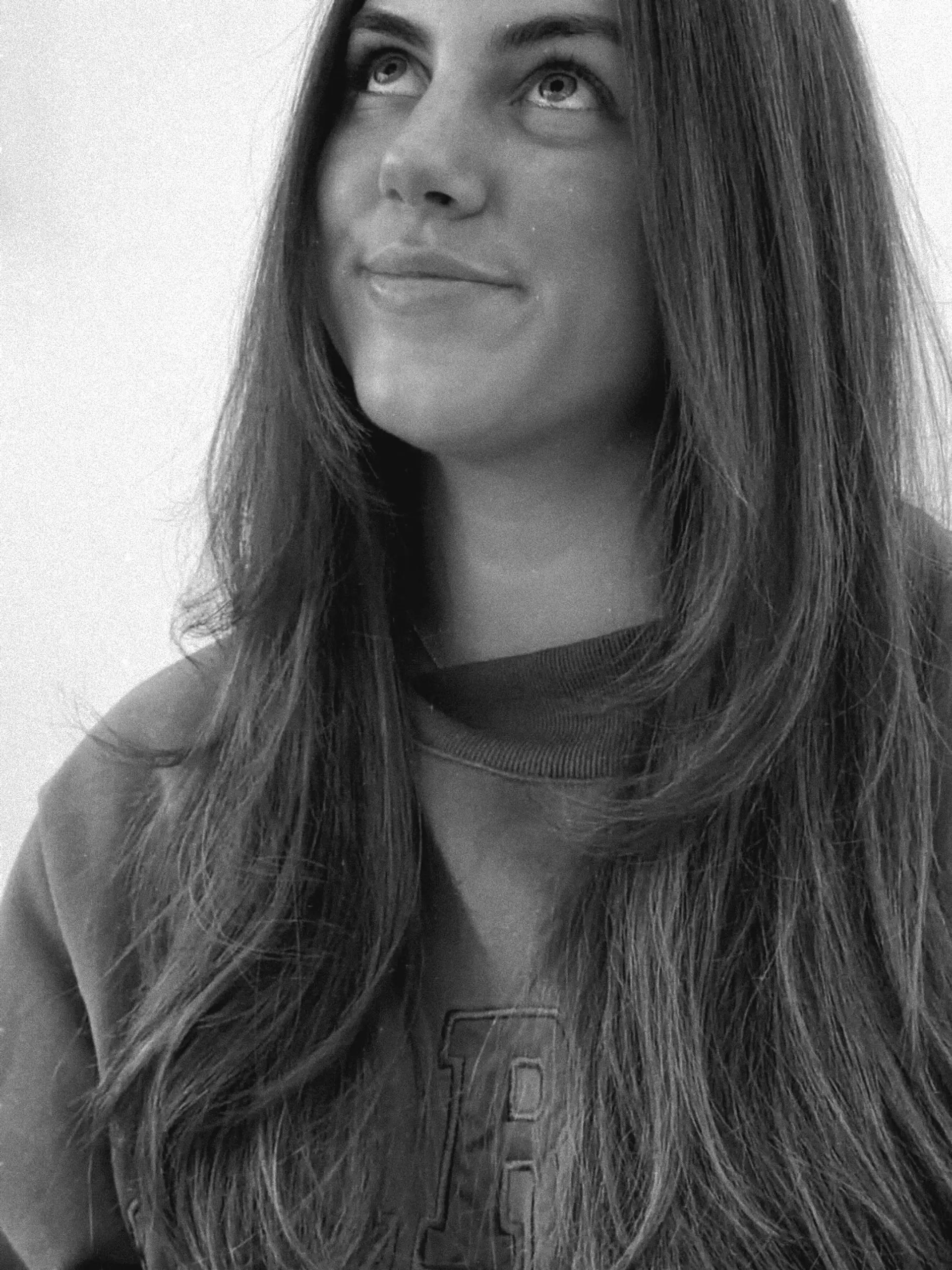 Long straight-to-subtly-textured hair featuring soft face-framing layers and styled with a smooth blowout finish. 1