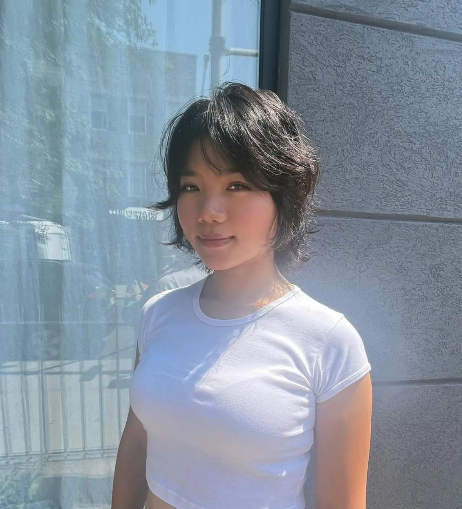 A sophisticated medium-length hairstyle with wavy, black locks, expertly layered with a light fringe that frames the face, featuring a modern bob cut.

Stylist: @reina_hair_ny
 1