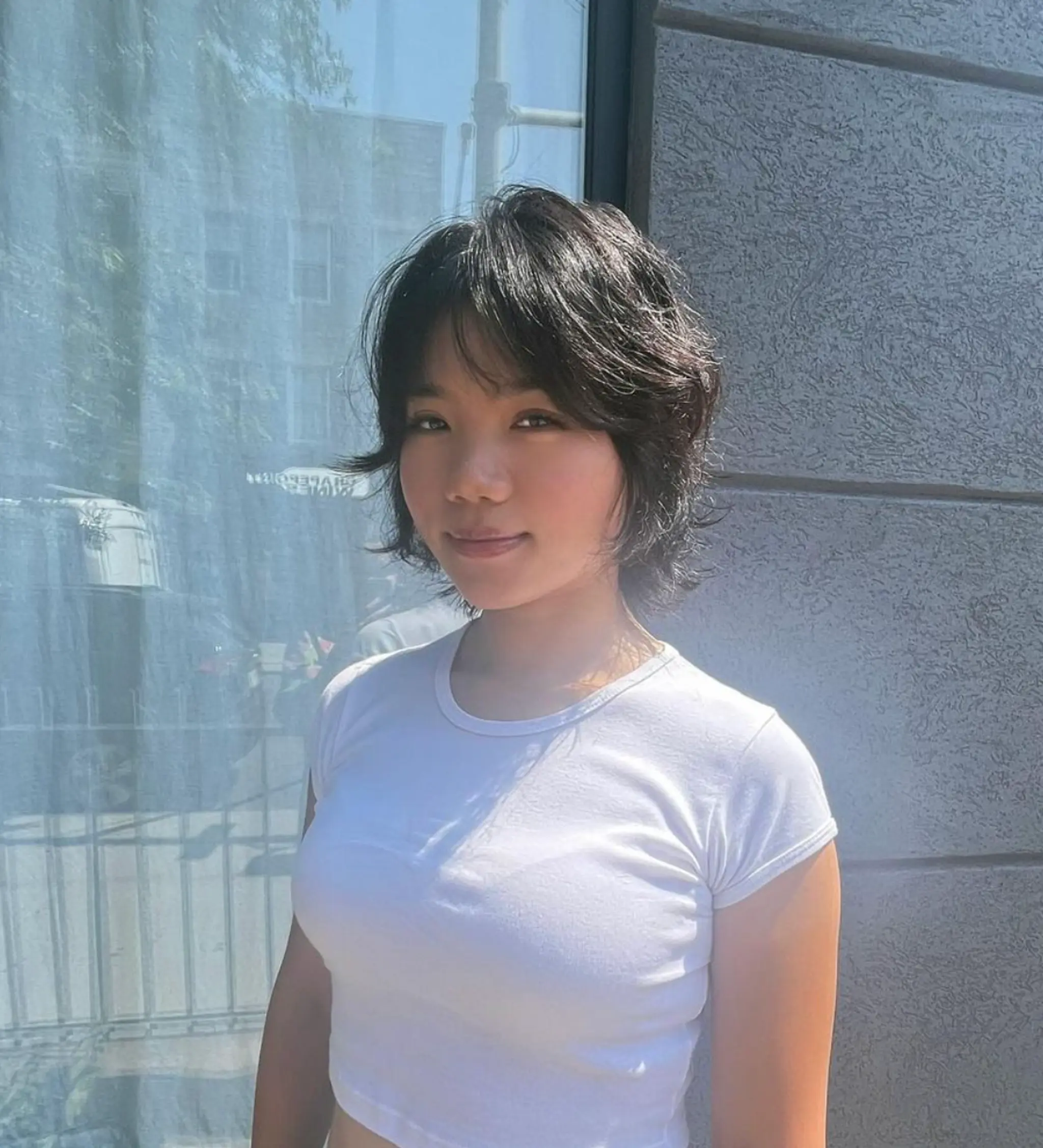 A sophisticated medium-length hairstyle with wavy, black locks, expertly layered with a light fringe that frames the face, featuring a modern bob cut.

Stylist: @reina_hair_ny
