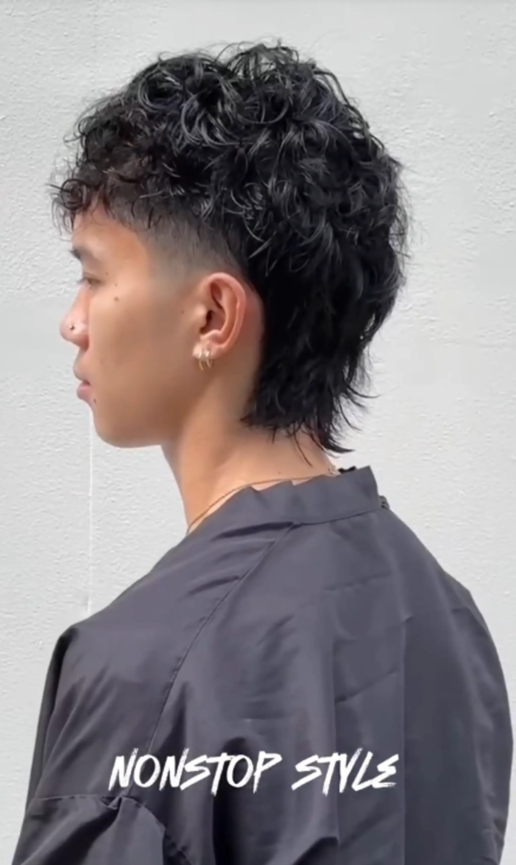 Medium-length curly modern mullet with voluminous curls on top and crown, transitioning into a textured, layered mullet at the back. The sides are slightly tapered to frame the face.
(NonstopStyle: by Vincent)