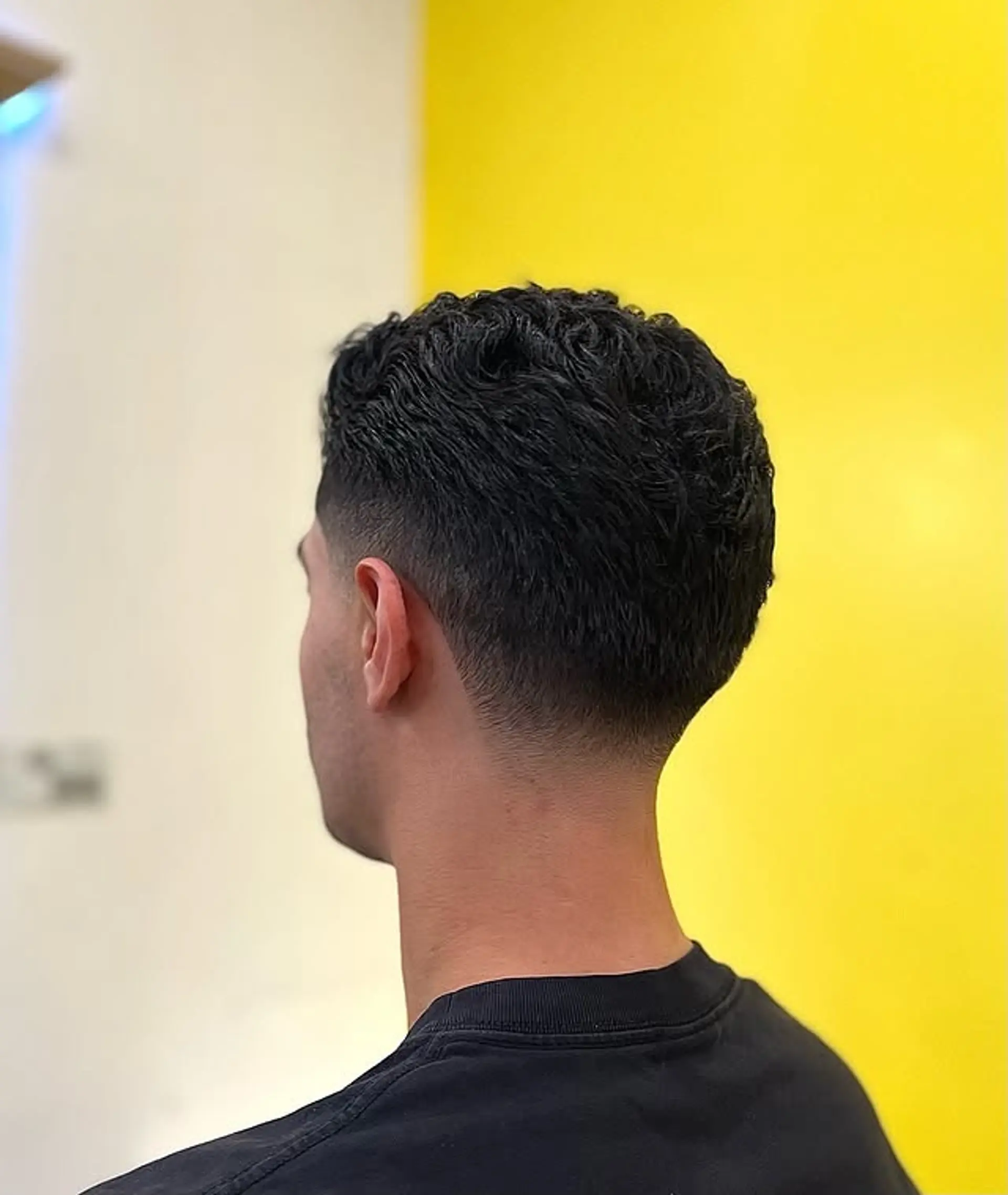 A textured crop with a clean fade for a stylish, low-maintenance look. 1