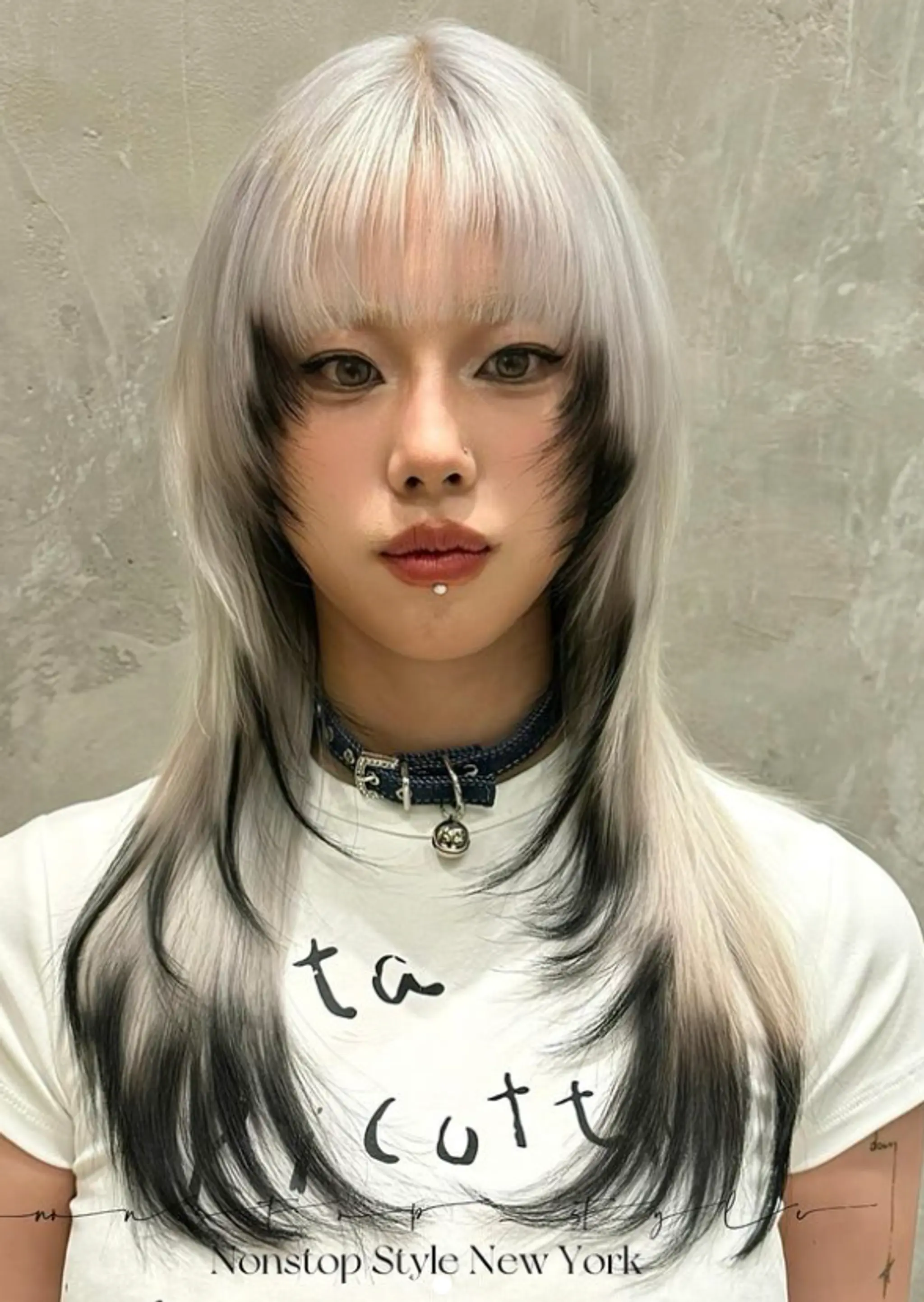 A long, straight hairstyle with a dramatic silver and black ombre effect, featuring full straight bangs and blended layers for a striking contrast and elegant look.
(NonstopStyle: by Wendy)