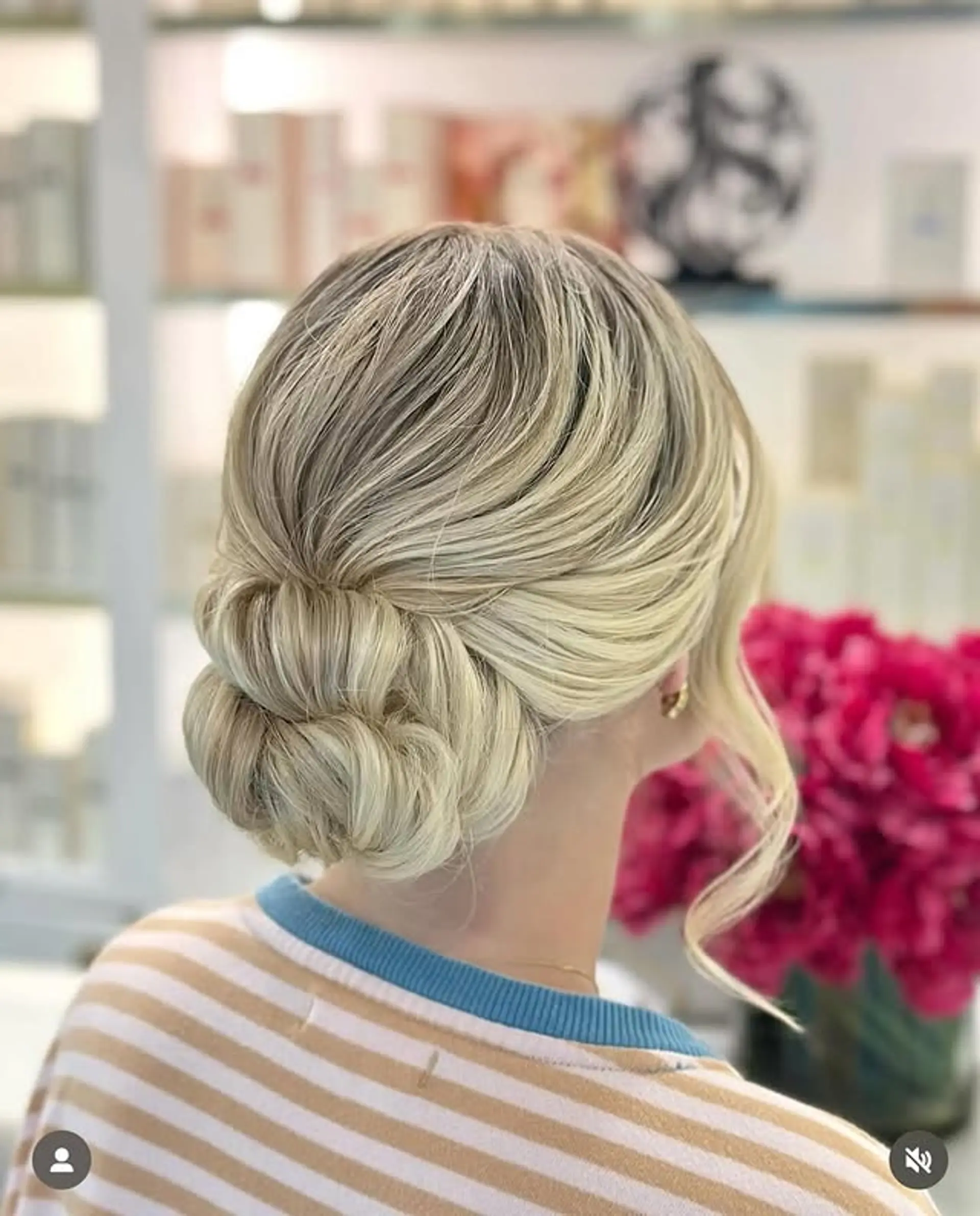 A chic and sophisticated low bun updo with a few loose strands. 1