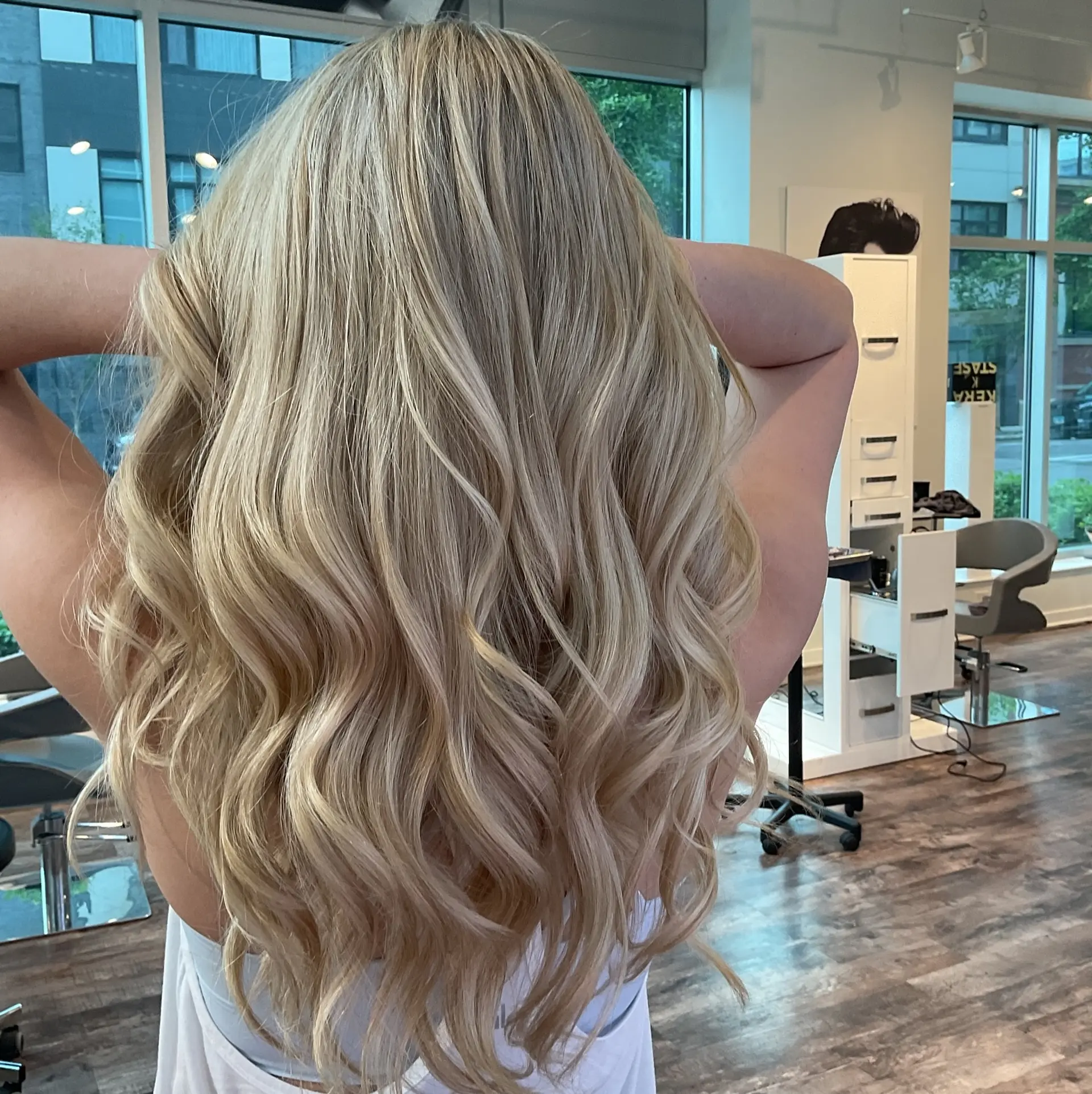 Long, wavy hair with an ash blonde balayage. 2